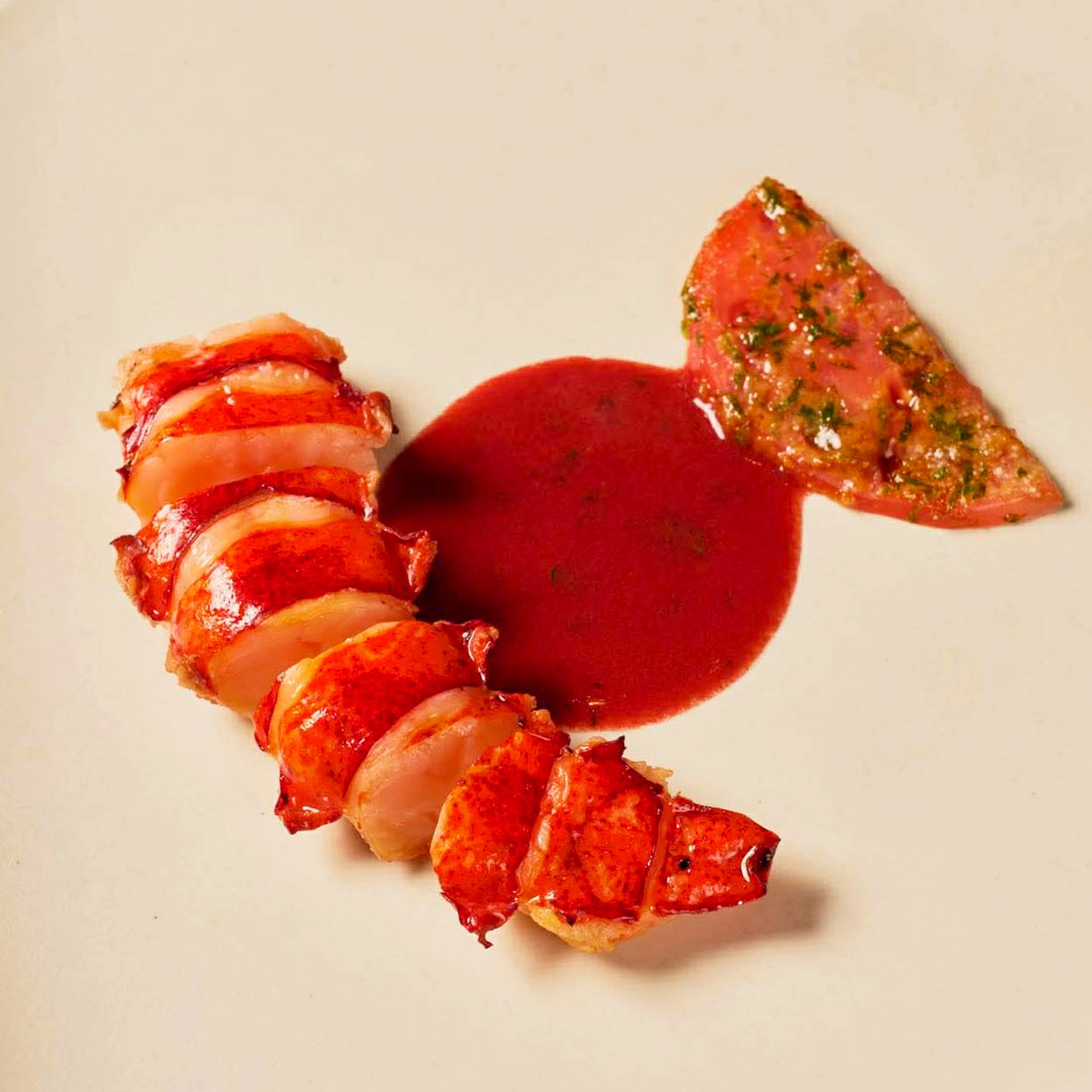 Oil-poached lobster, citrus compressed tomato, red lees and kesong puti beurre blanc