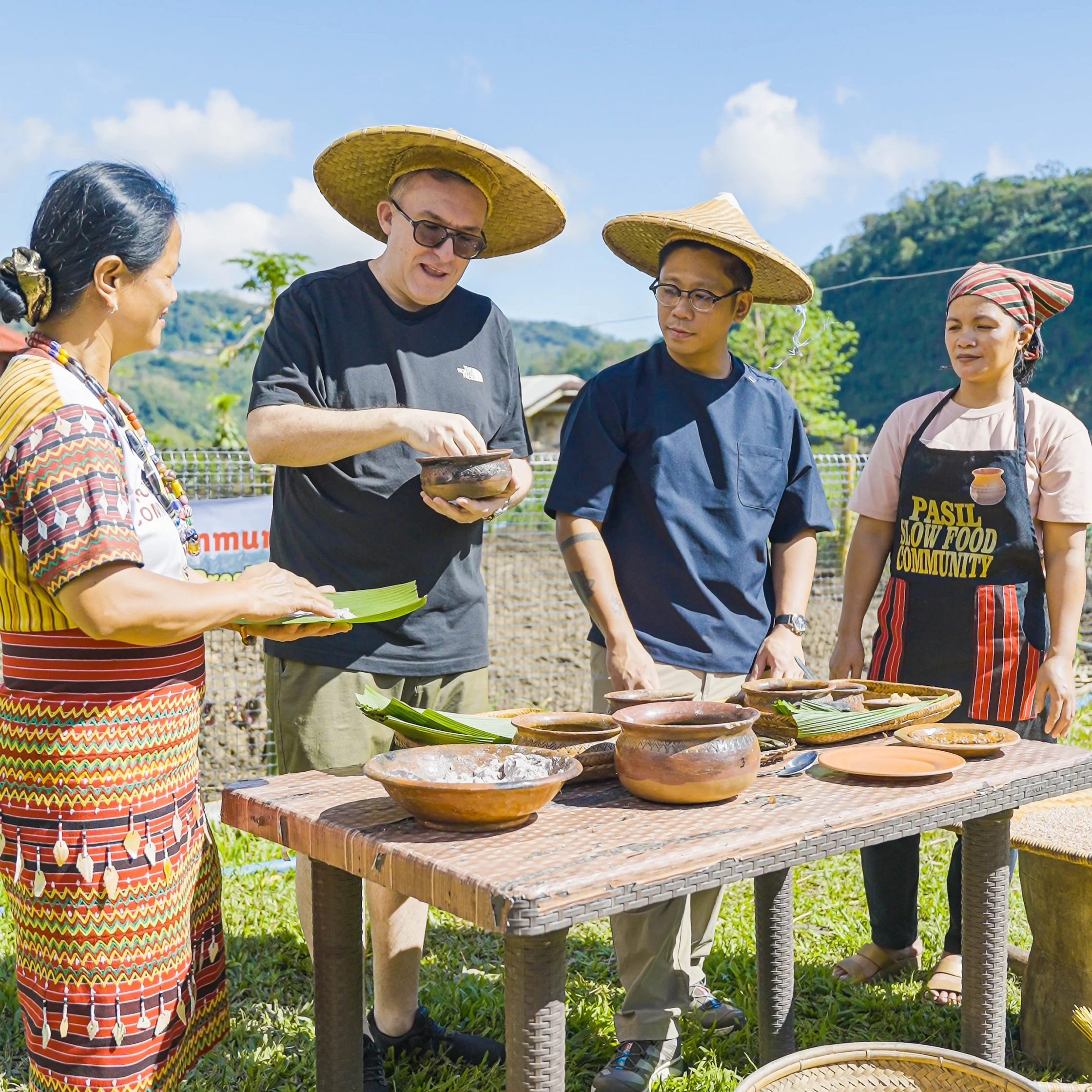 Chefs Chele González and Carlos Villaflor learning about heirloom rice in the Cordilleras