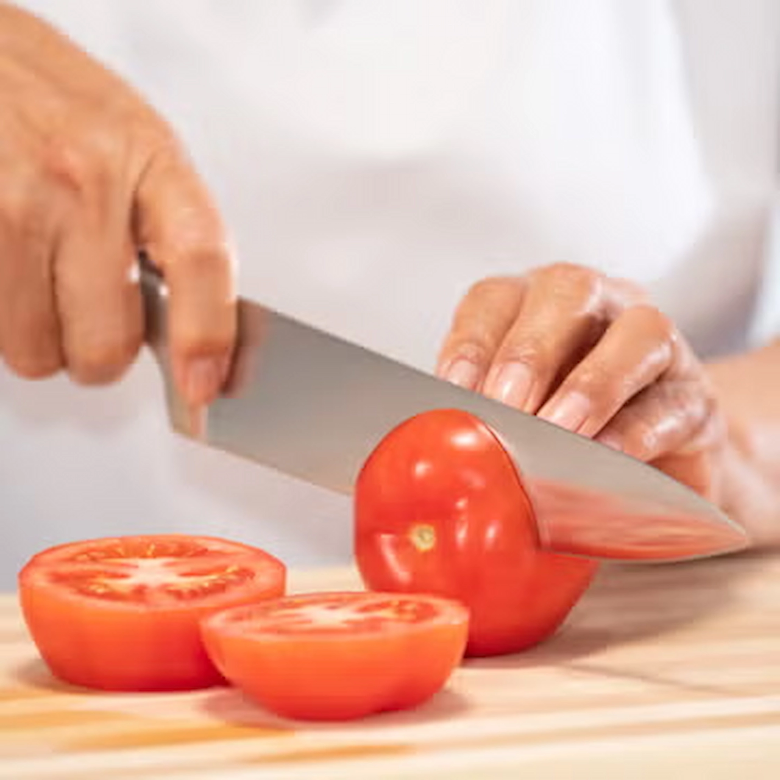 slicing tomatoes juicy and red