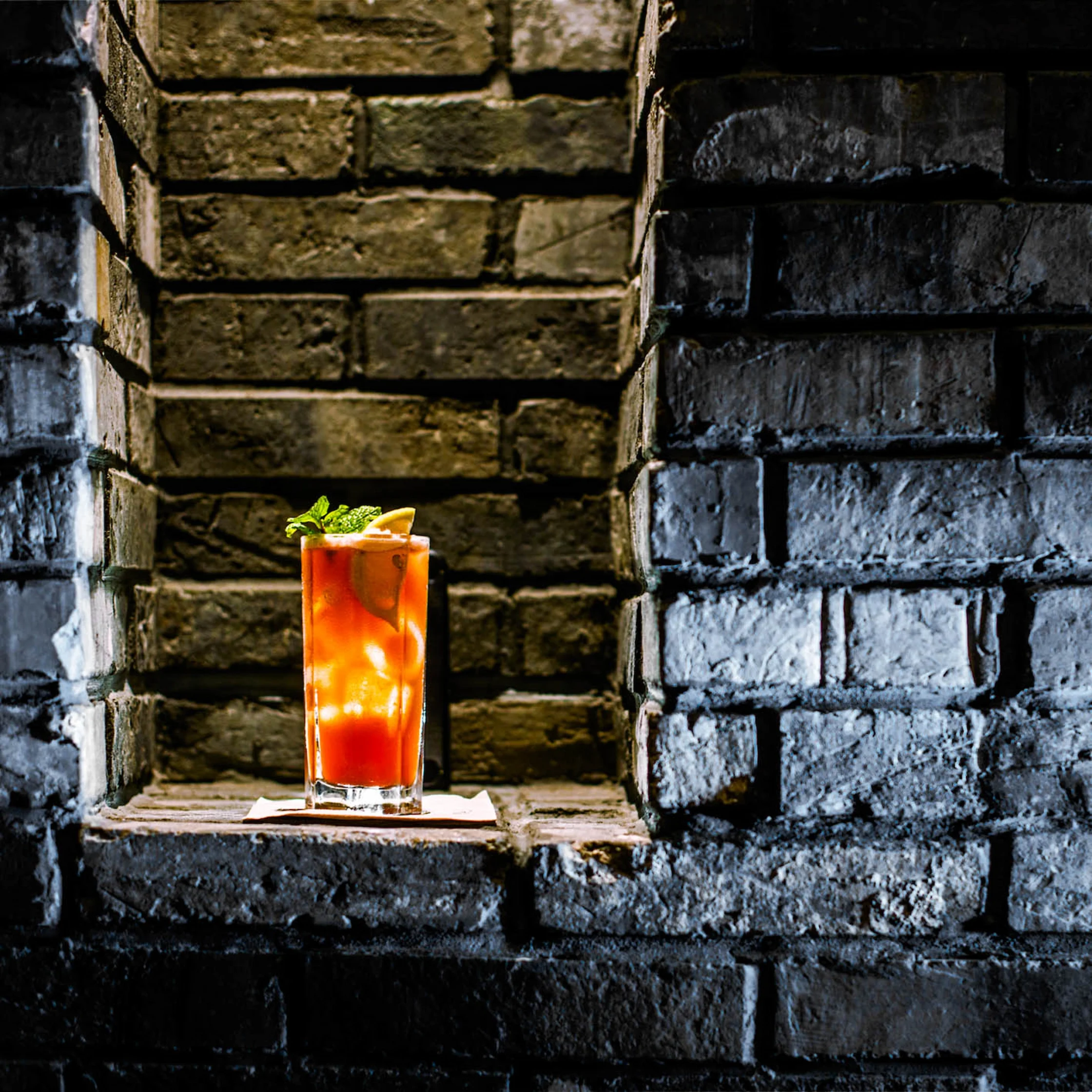 Cocktail from The Pig & Palm Cebu served in a tall glass with citrus and mint.
