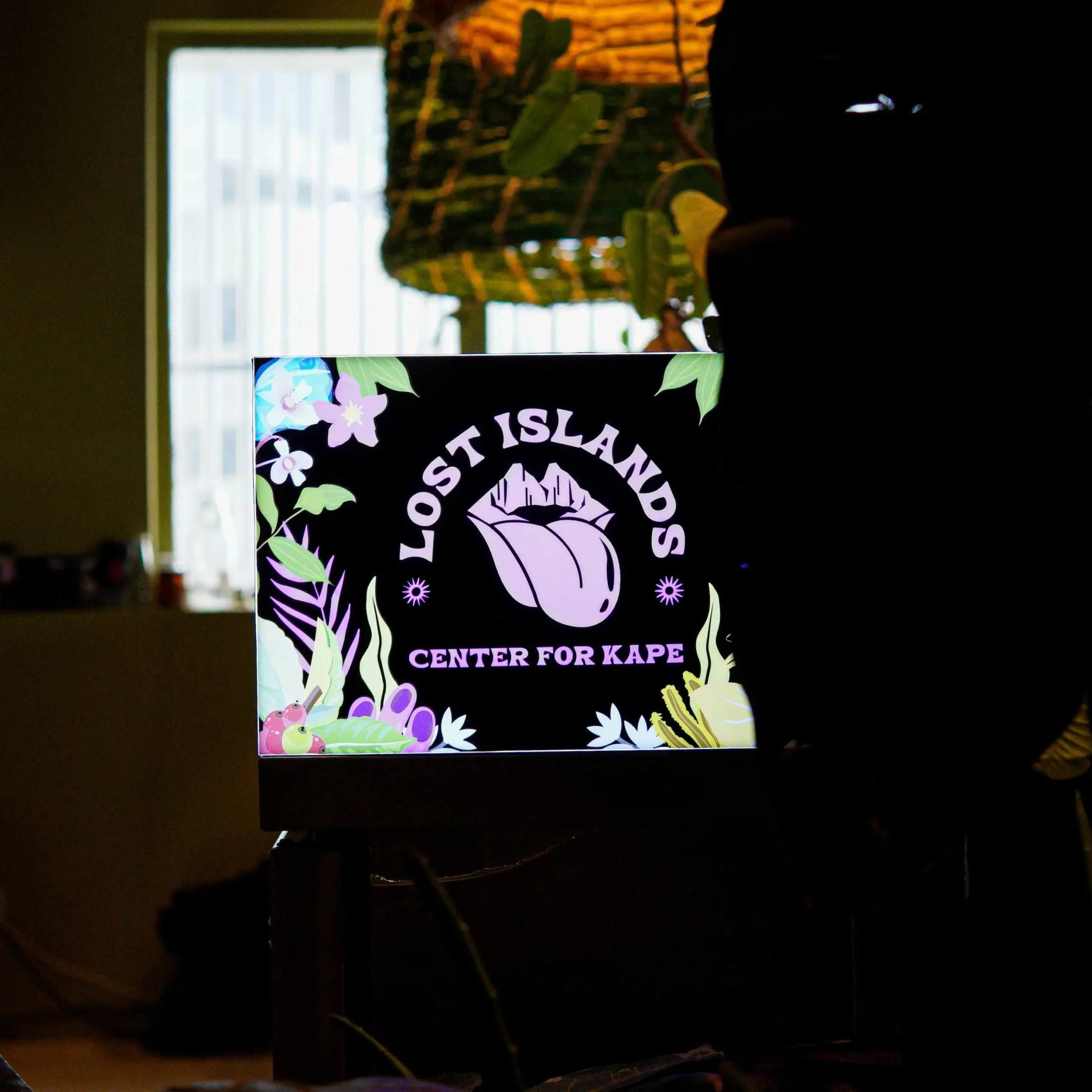 The bright and vibrant light-up signage of Lost Islands Center for Kape in Makati