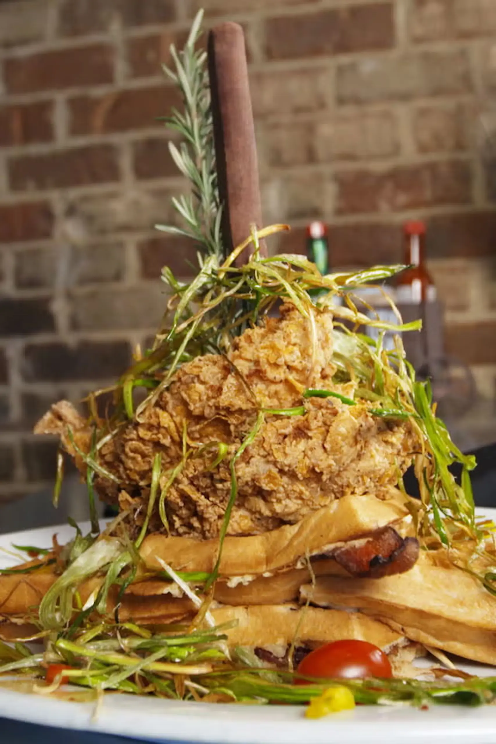 giant steak knife two gigantic fried chicken breasts, four waffles with bacon fried leeks Hash House A Go Go maple syrup reduction