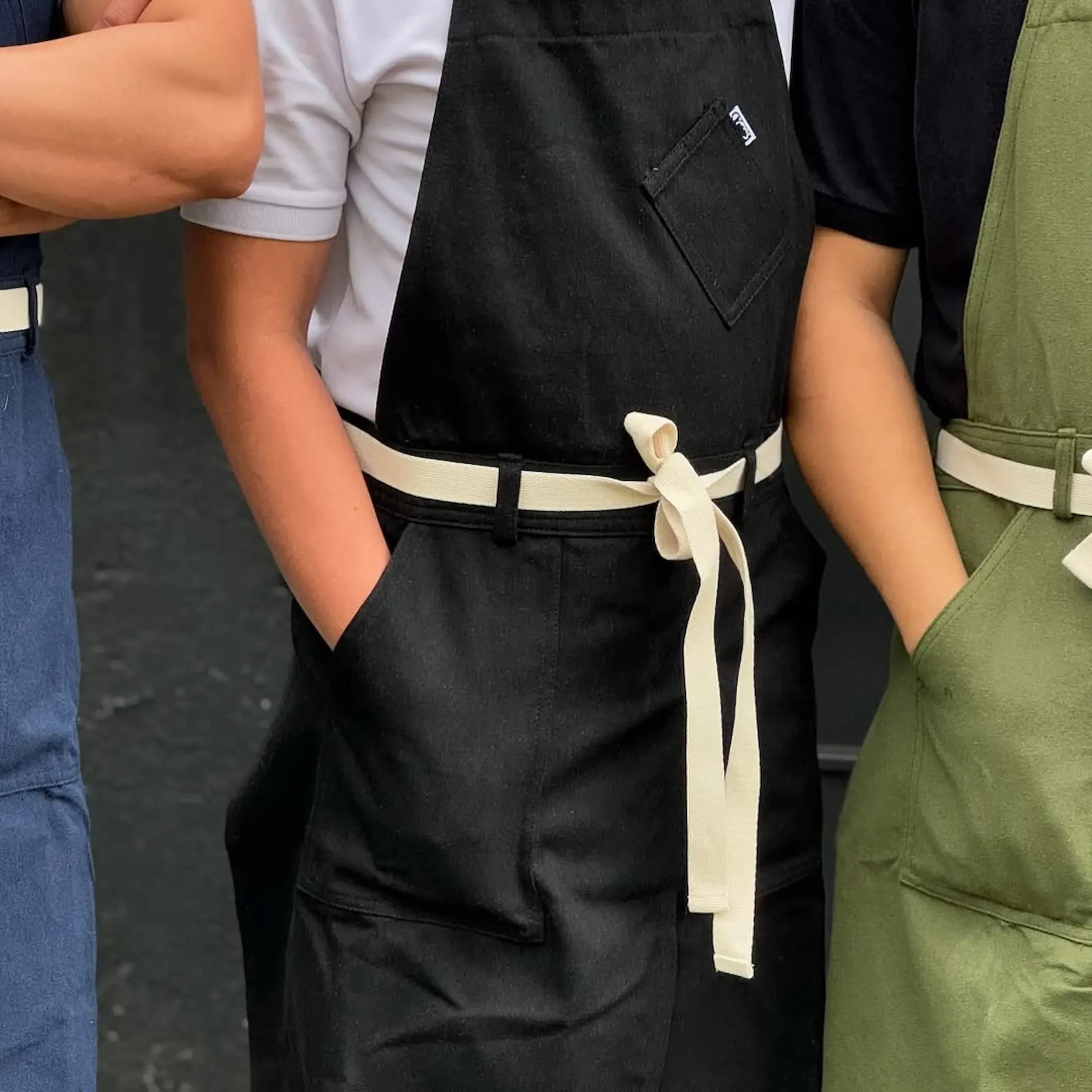 By Sondo's black apron