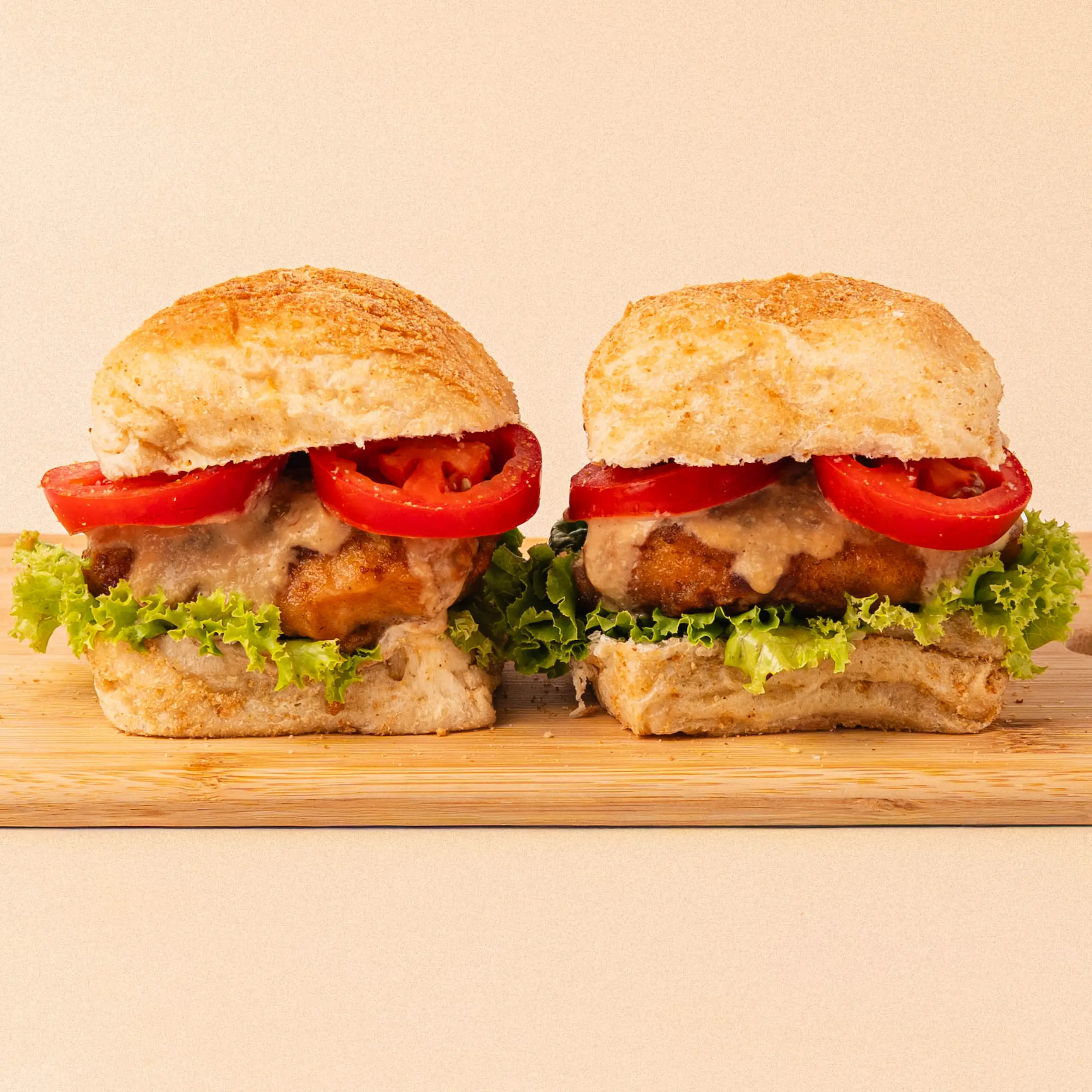 2 salted egg chicken sandwich on wooden slab