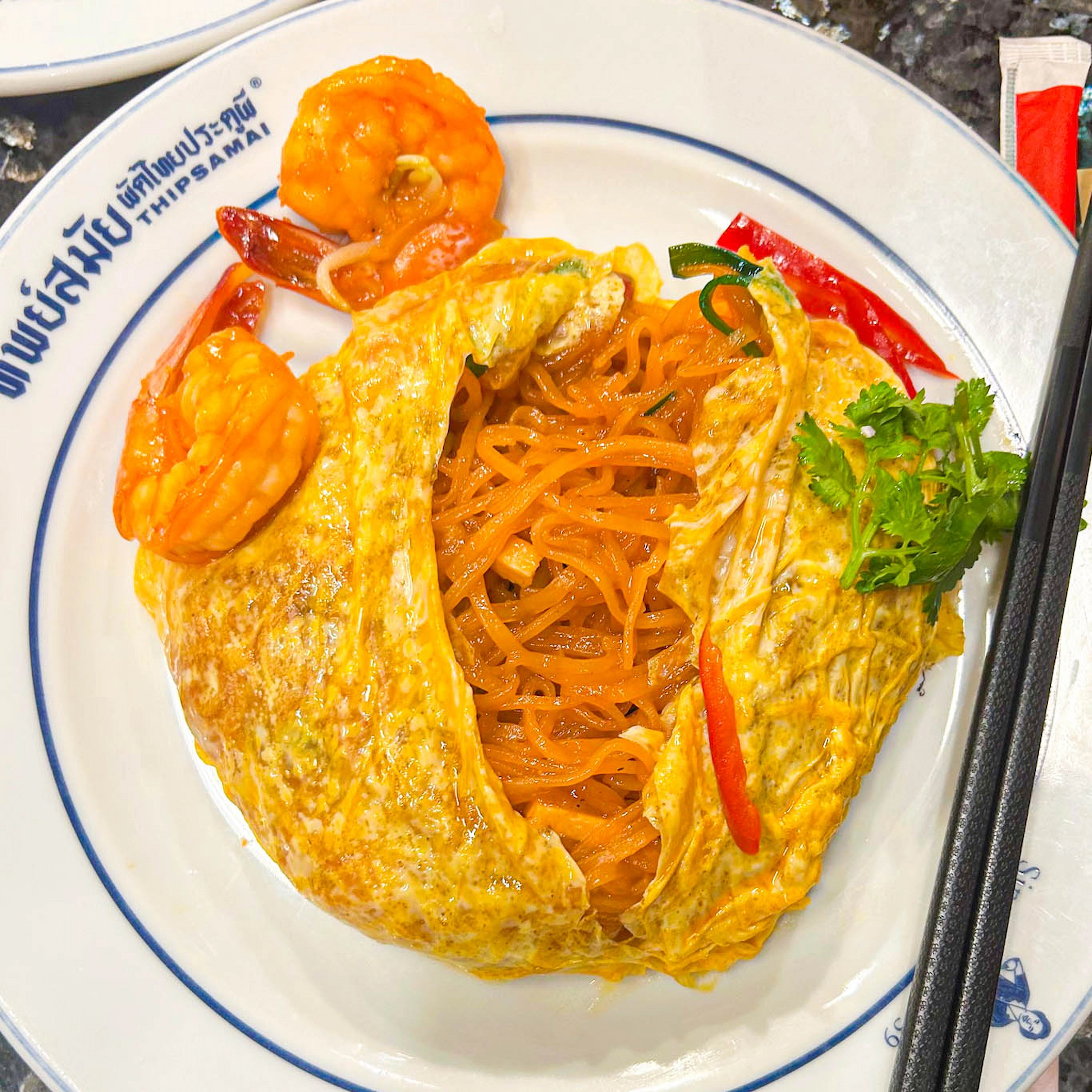 A highly recommended Pad Thai uses chewy Chanthaburi rice noodles, shrimp oil, and a tamarind sauce.