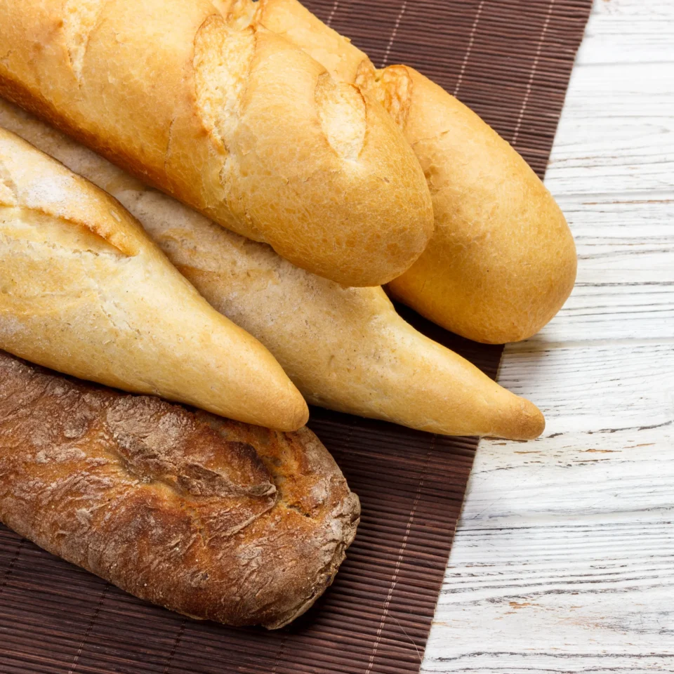 assortment-of-fresh-french-baguettes-on-a-wooden-t-2026-01-08-21-58-29-utc