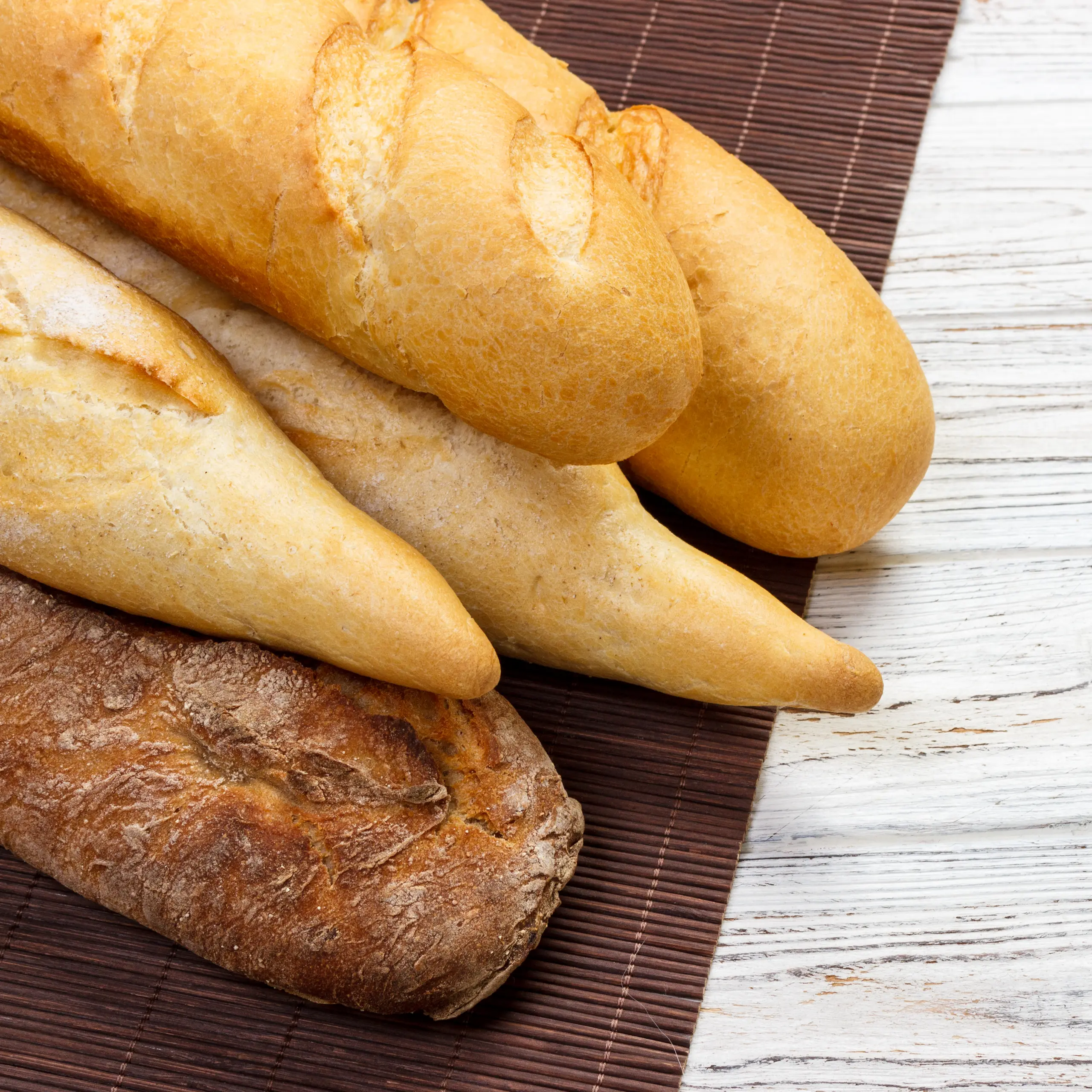 assortment-of-fresh-french-baguettes-on-a-wooden-t-2026-01-08-21-58-29-utc