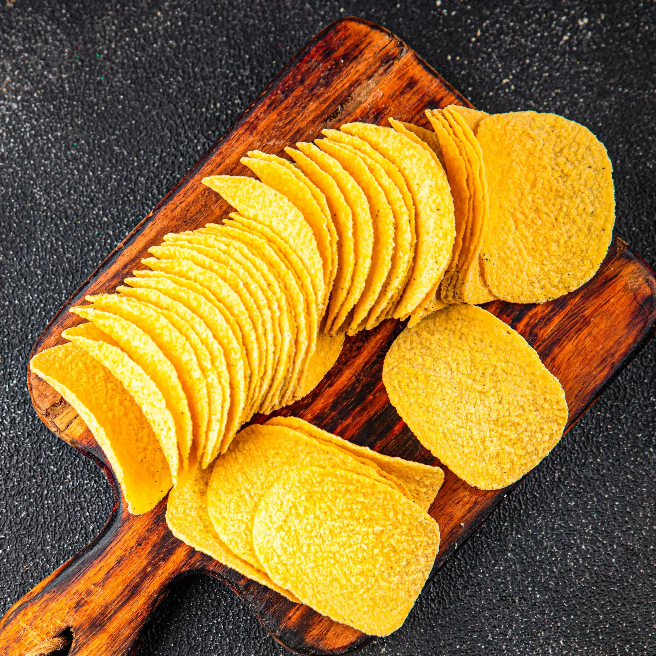 crunchy chips with lots of sodium and salt which causes bloating