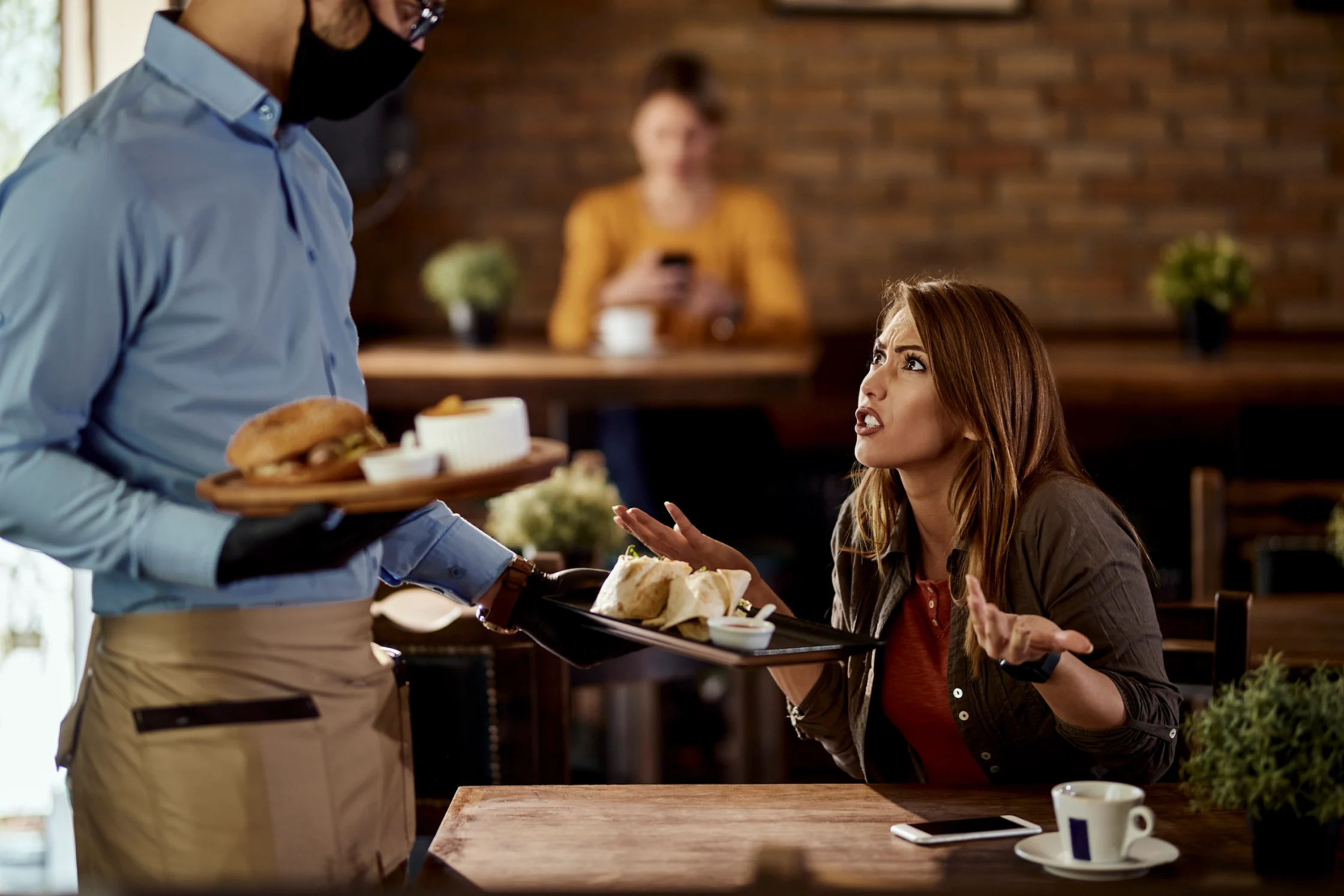 displeased customer arguing with waiter about food