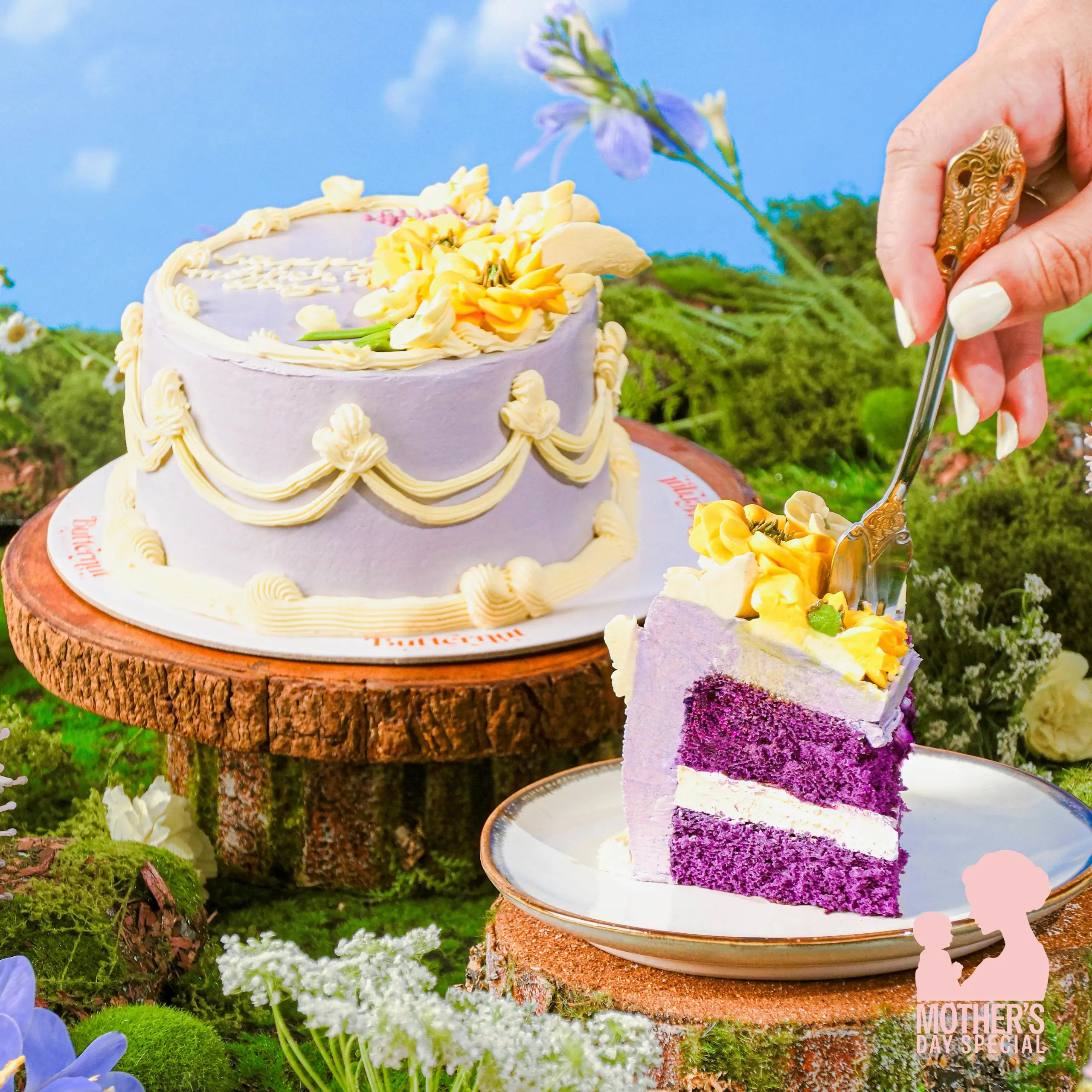 Lavender-frosted cake with yellow flower decorations on a wooden log, outdoors, being sliced; 