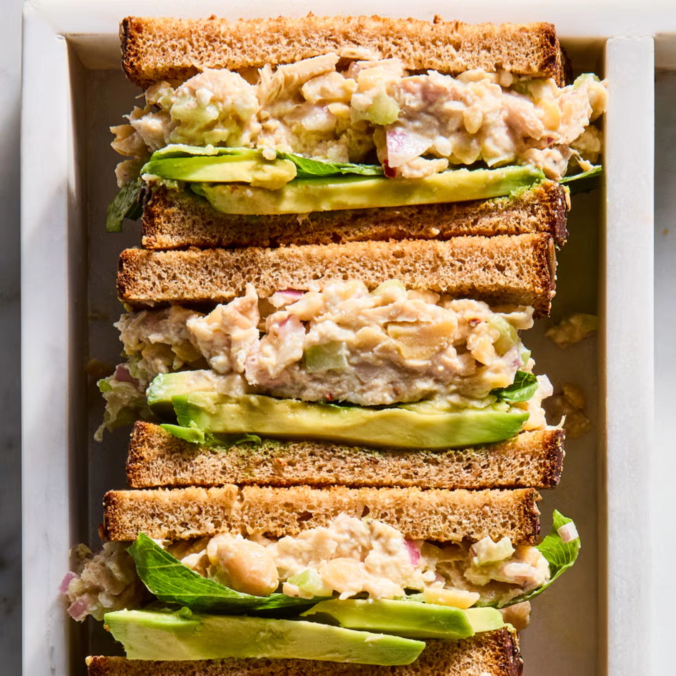 Wide shot, 3 tuna avocado sandwiches