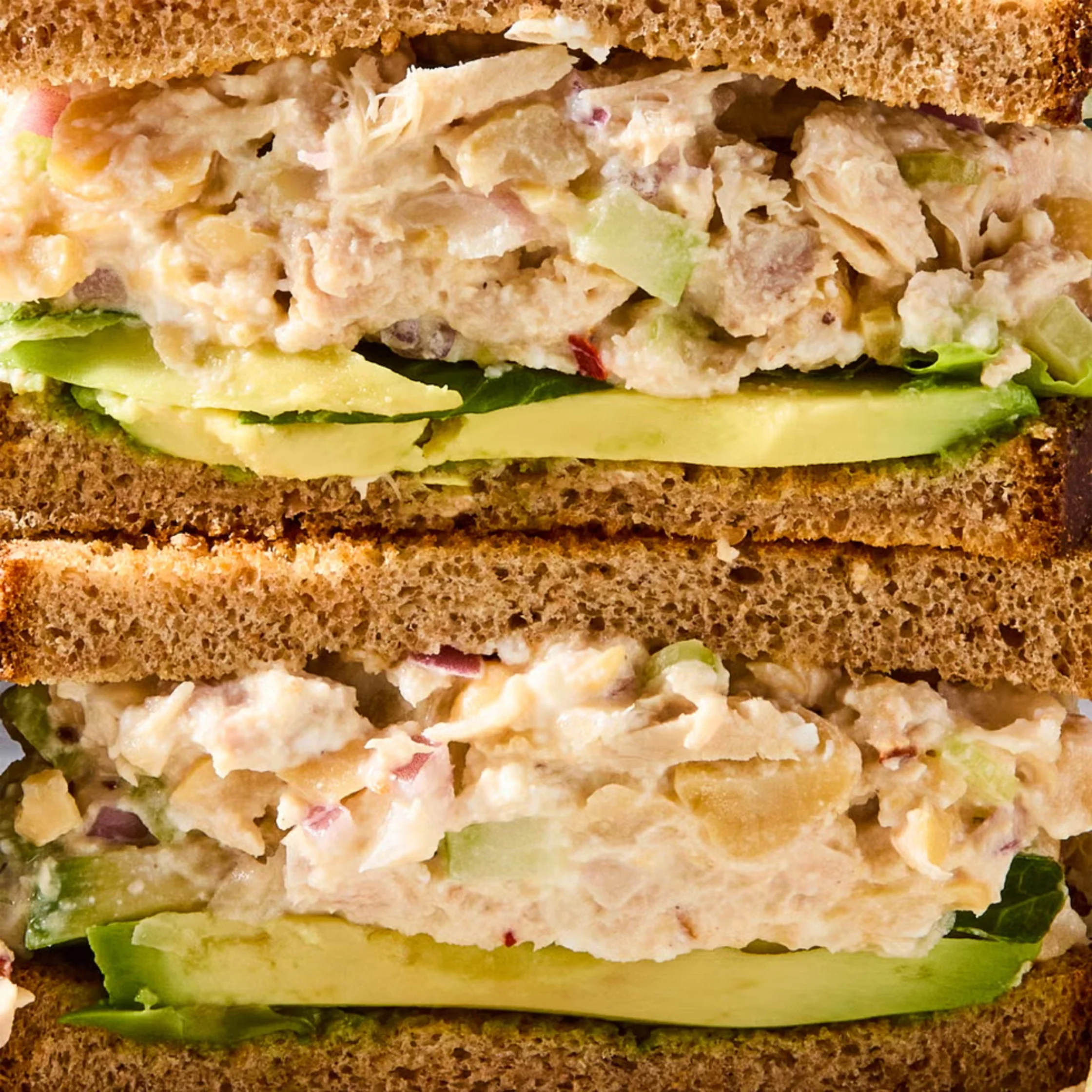 close up of middle section of tuna avocado sandwich
