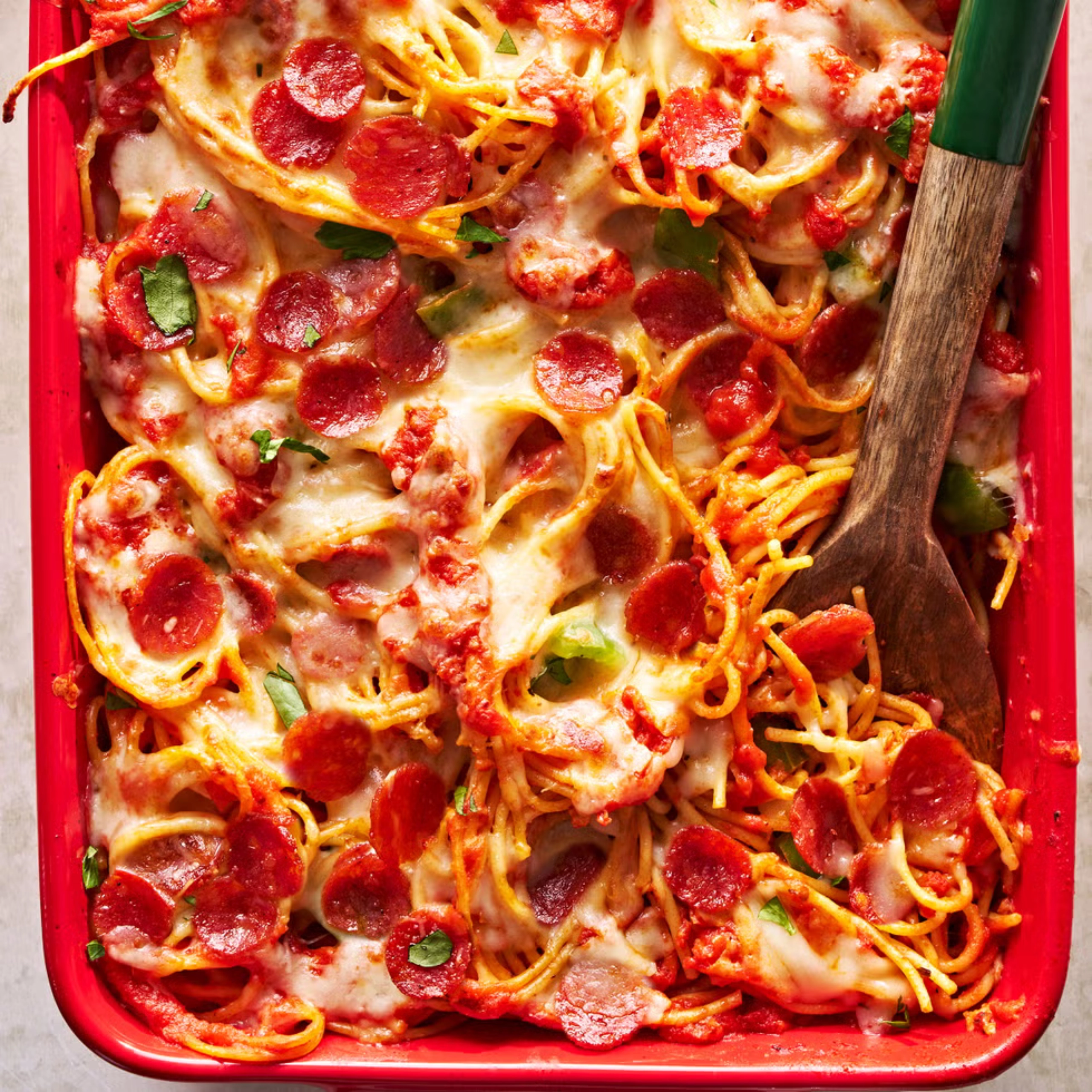 Pizza Spaghetti with wooden spoon