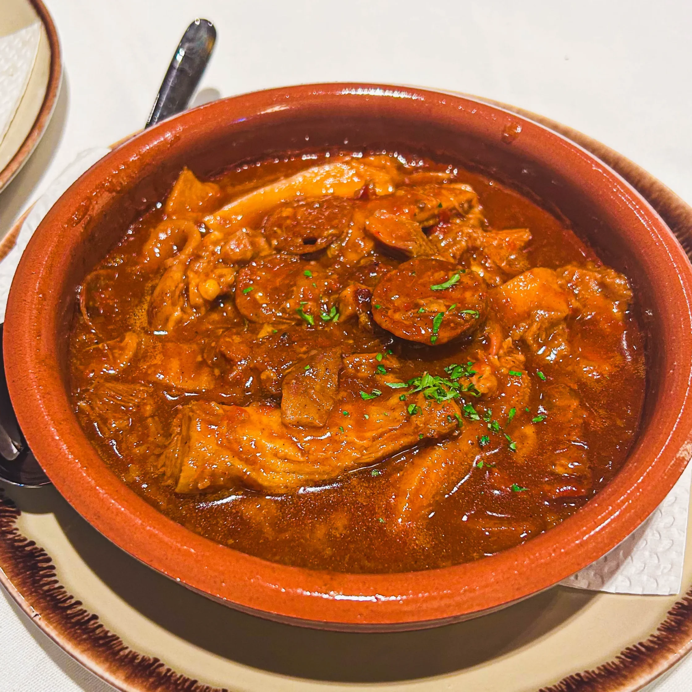 Callos at Asador de Aranda Manila, Spanish-style tripe stew with chorizo and rich tomato sauce served in a traditional clay pot