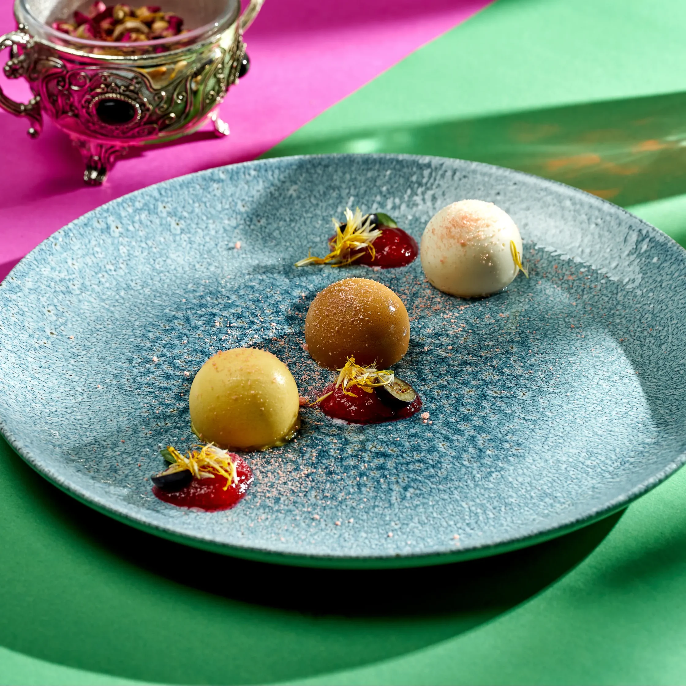 Modern white coupe plate with a wide rim and shallow curved design, partially plated with fresh mixed greens and cherry tomatoes, ideal for contemporary restaurant-style food presentation.