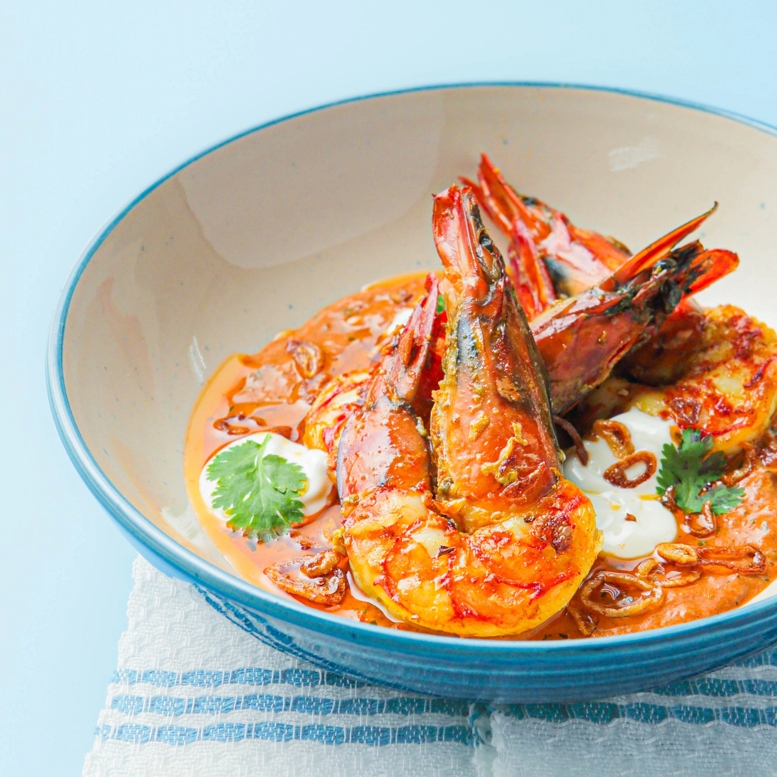 coconut prawn masala red sauce in a bowl