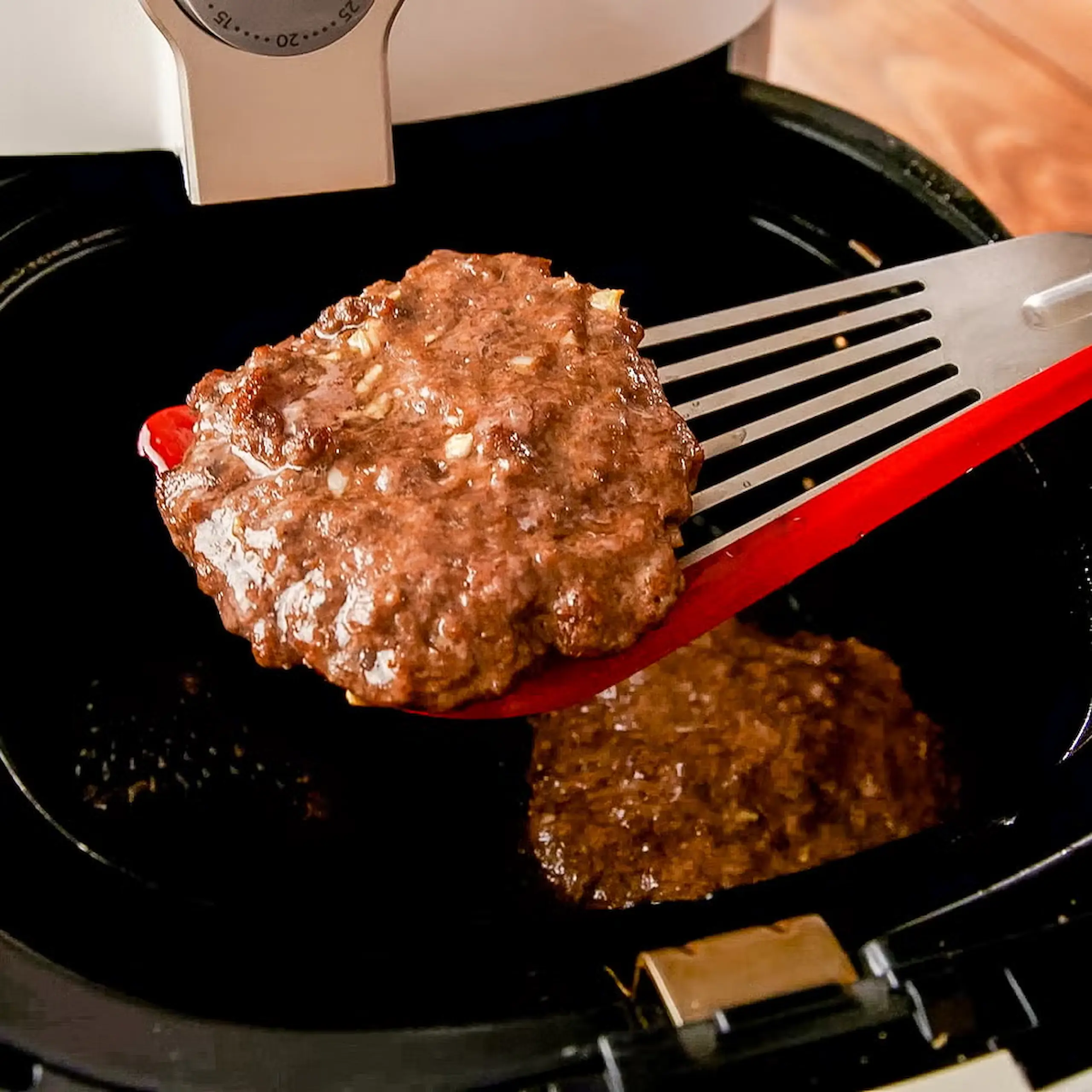 burger patty in cooking in air-fryer