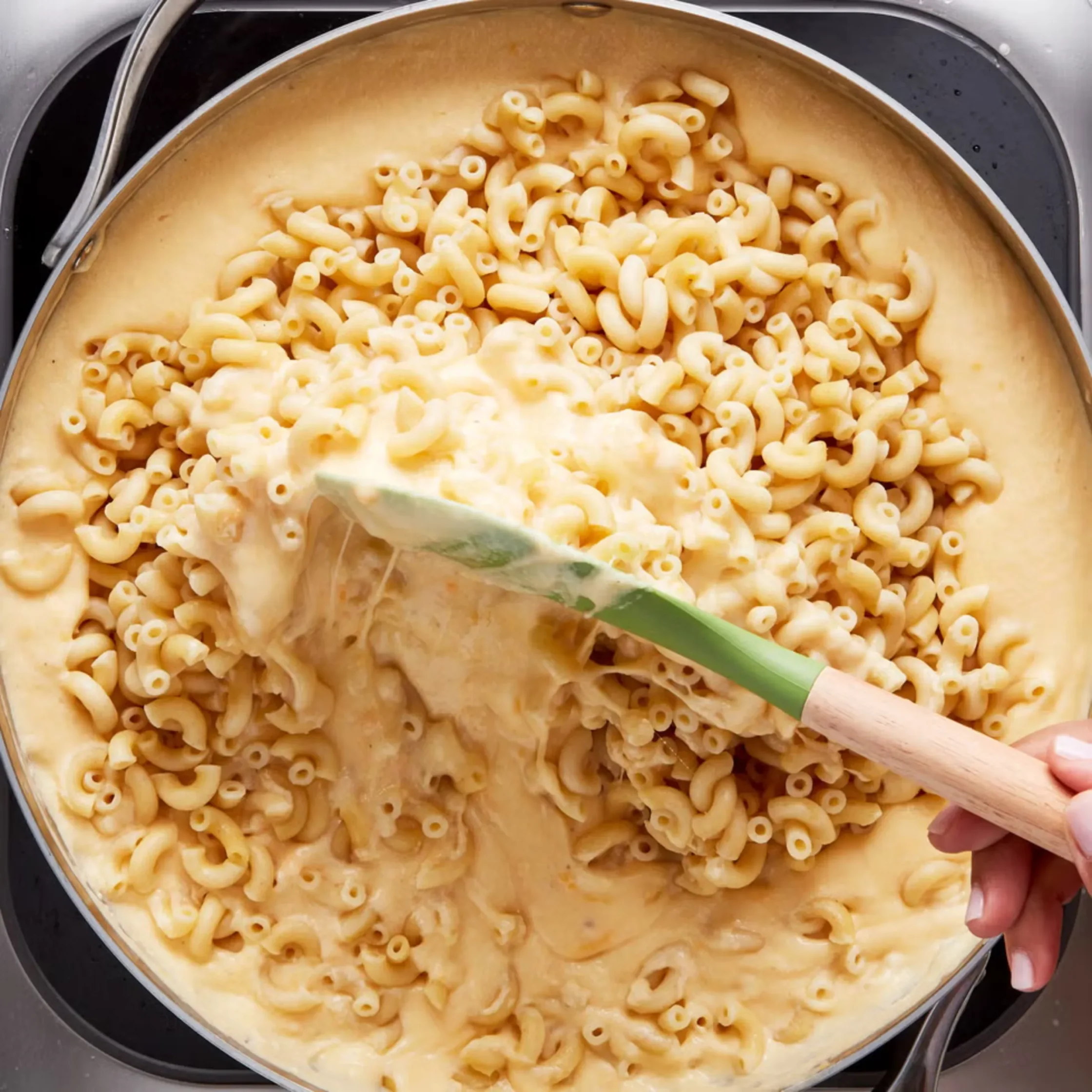 stir in cooked elbow pasta in cheese mixture