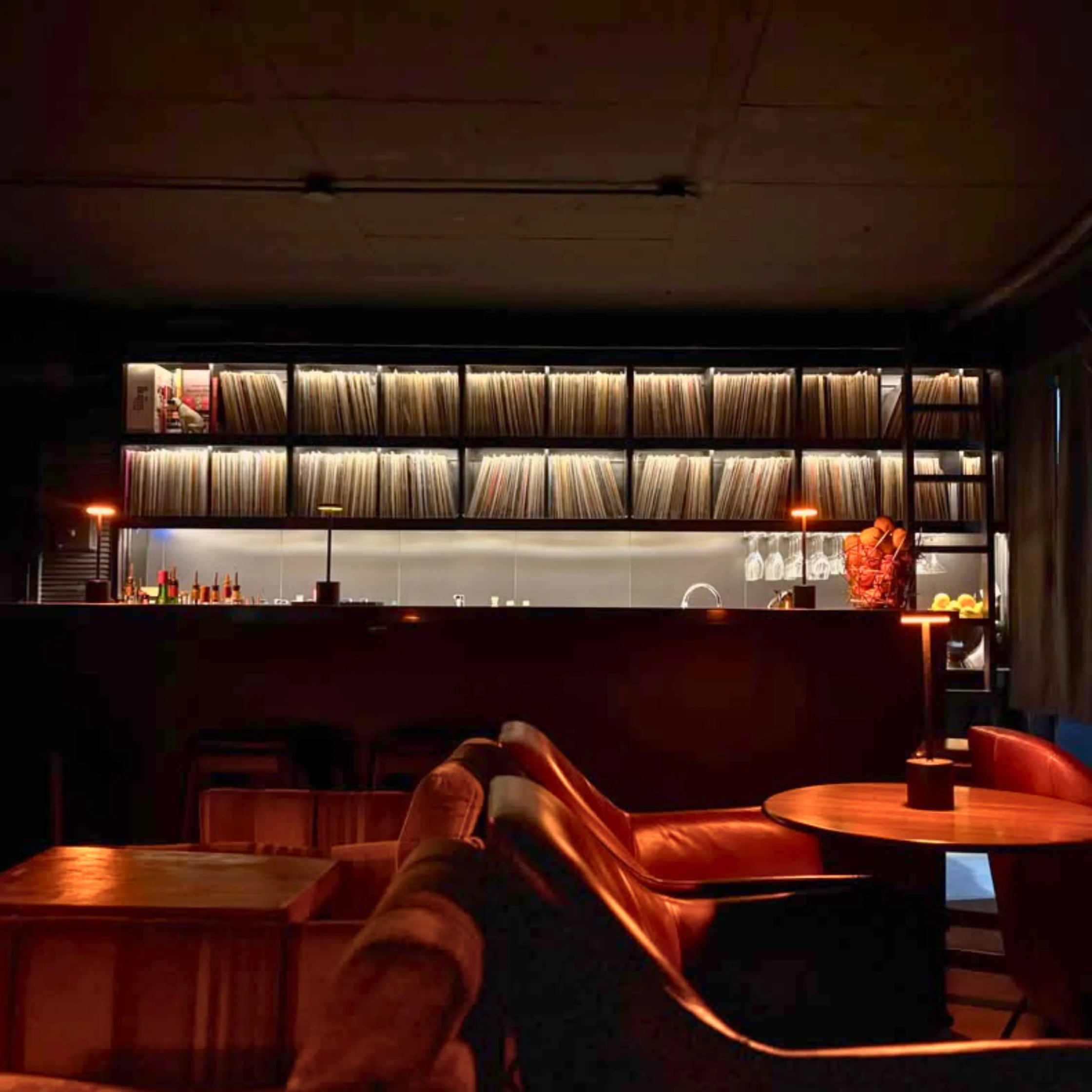 Vinyl records displayed inside 78-45-33 listening bar in Salcedo Village.