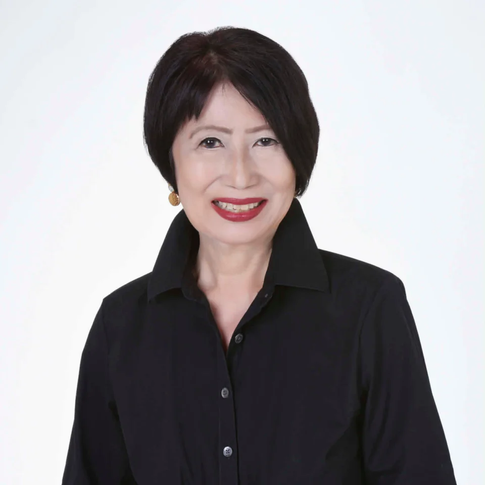 Portrait of Food Historian Felice Prudente Sta. Maria with short black hair wearing a black collared shirt, smiling against a plain white background.