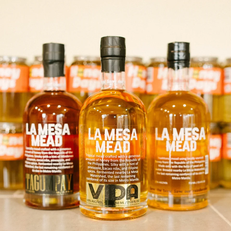 Assortment of LA MESA MEAD products, including Tagumpay and Vida varieties, arranged together with branded packaging visible.