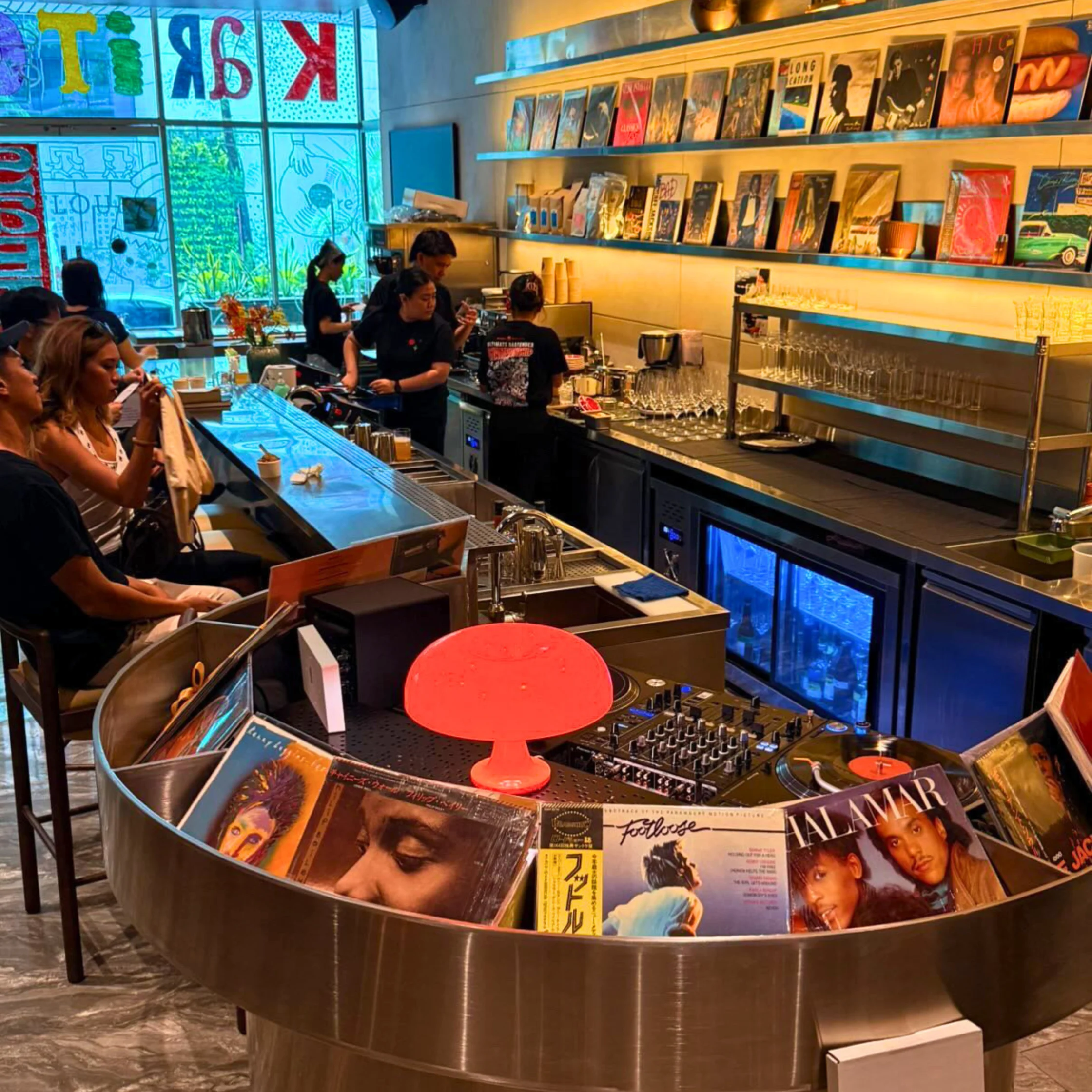 DJ booth and vinyl records inside Sabi Sounds listening café in Salcedo Village.