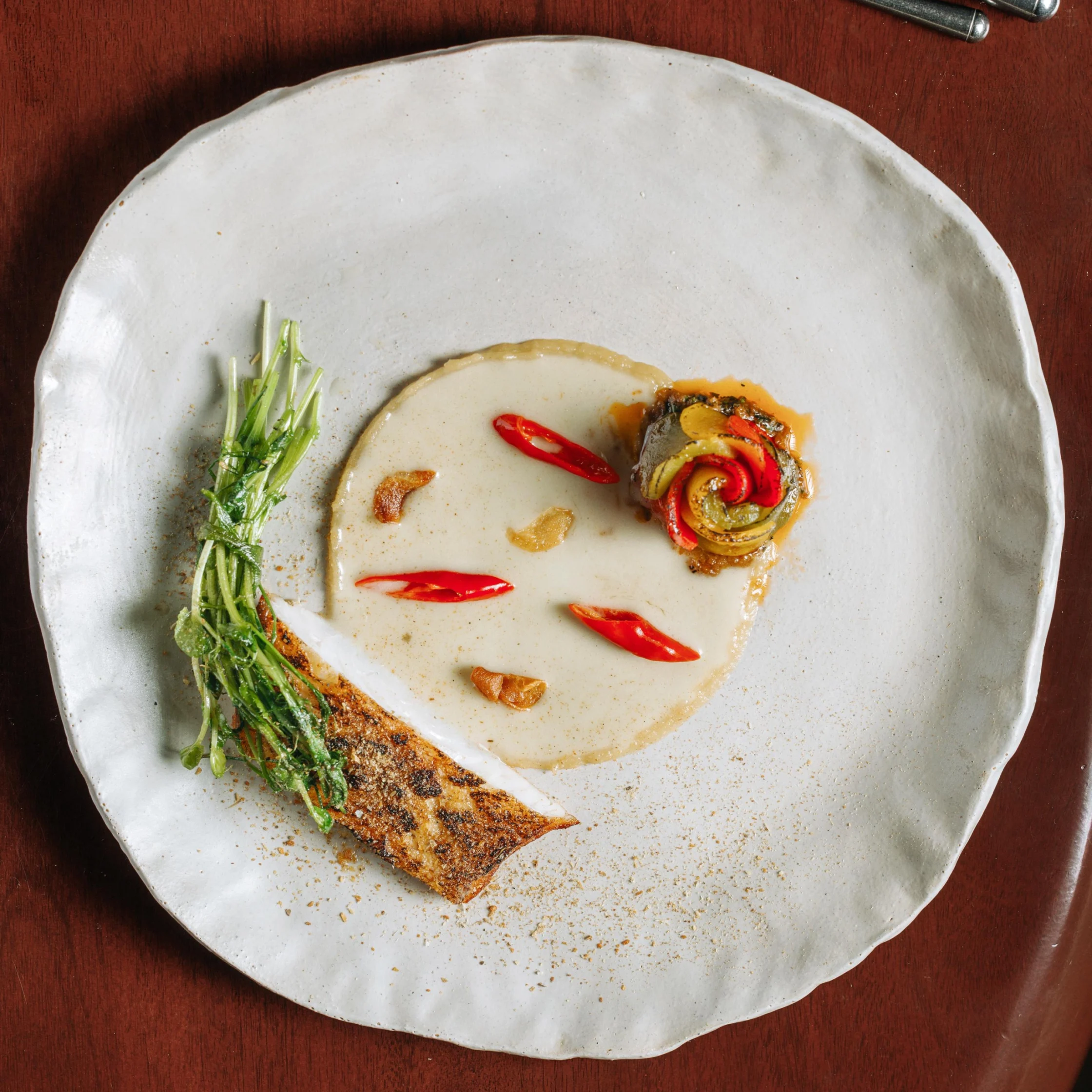 a la basquaise composed of coral trout sinamak pil-pil sauce and piperade kasa palma new menu by aaron isip