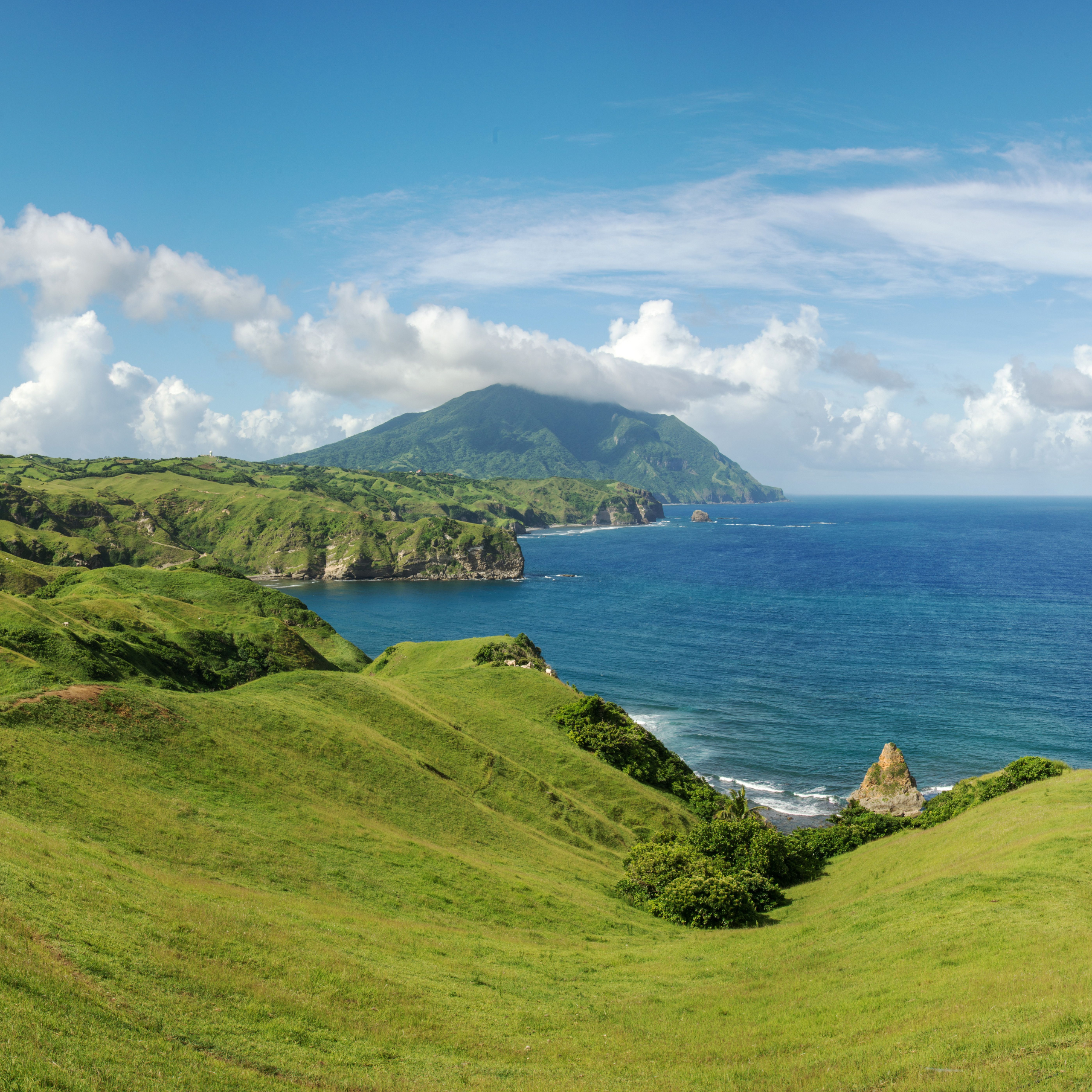 batanes island philippines green scenery ocean water blue