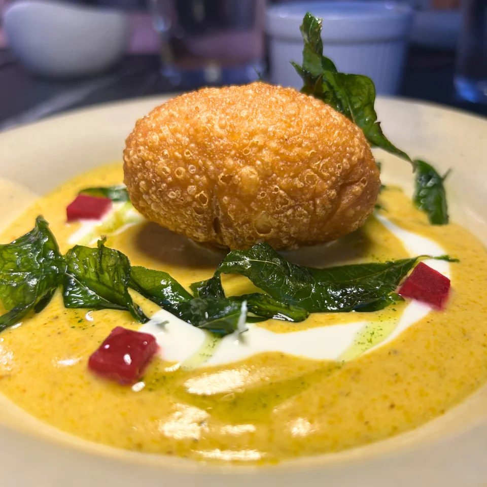 Chicken kachori is a popular, savory deep-fried pastry filled with spiced minced or shredded chicken. It features a crispy, flaky outer crust and a flavorful, tender interior, and is usually served hot with mint chutney, ketchup, or sweet tamarind sauce.