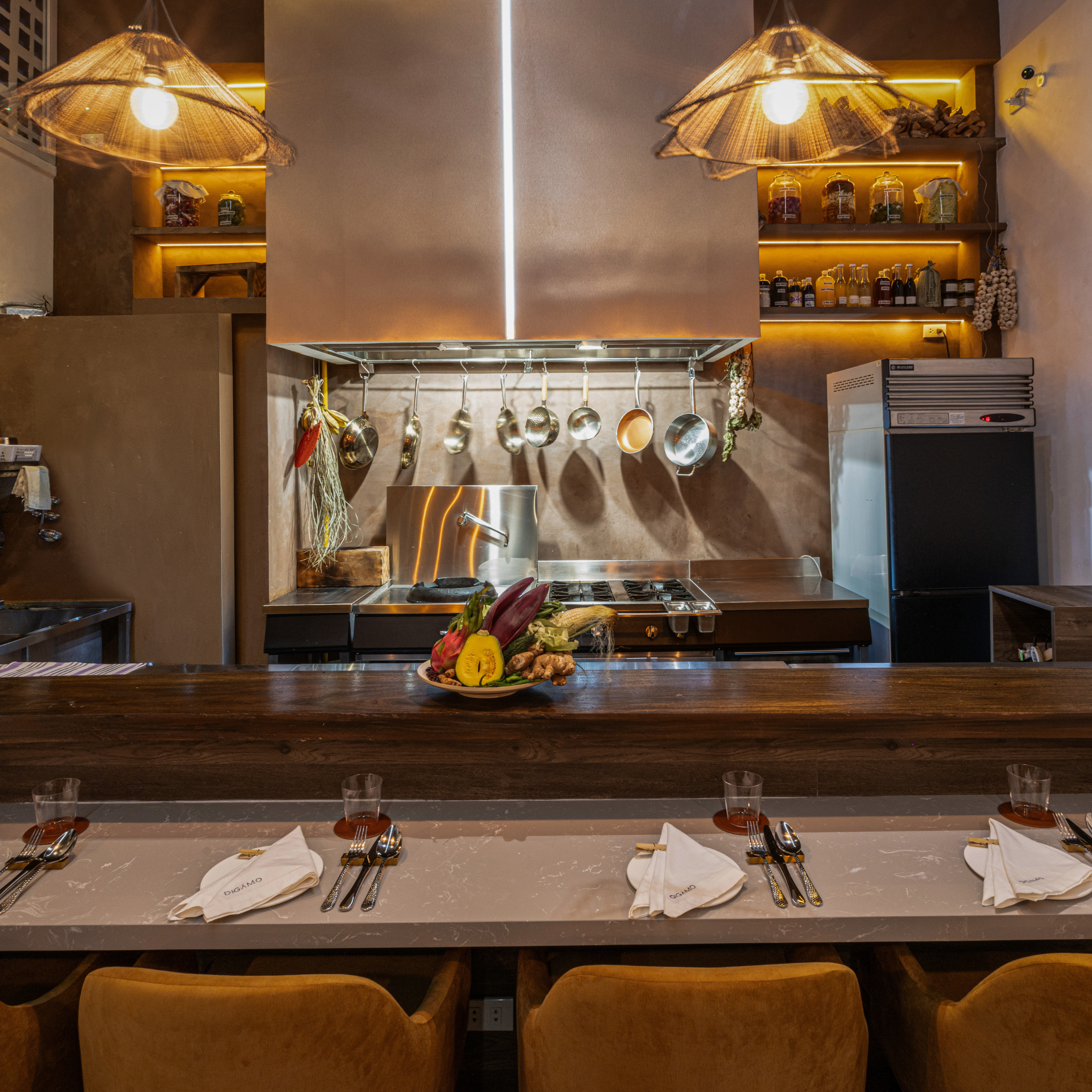 digamo restaurant in makati interiors with stainless steel and wood and moody lighting