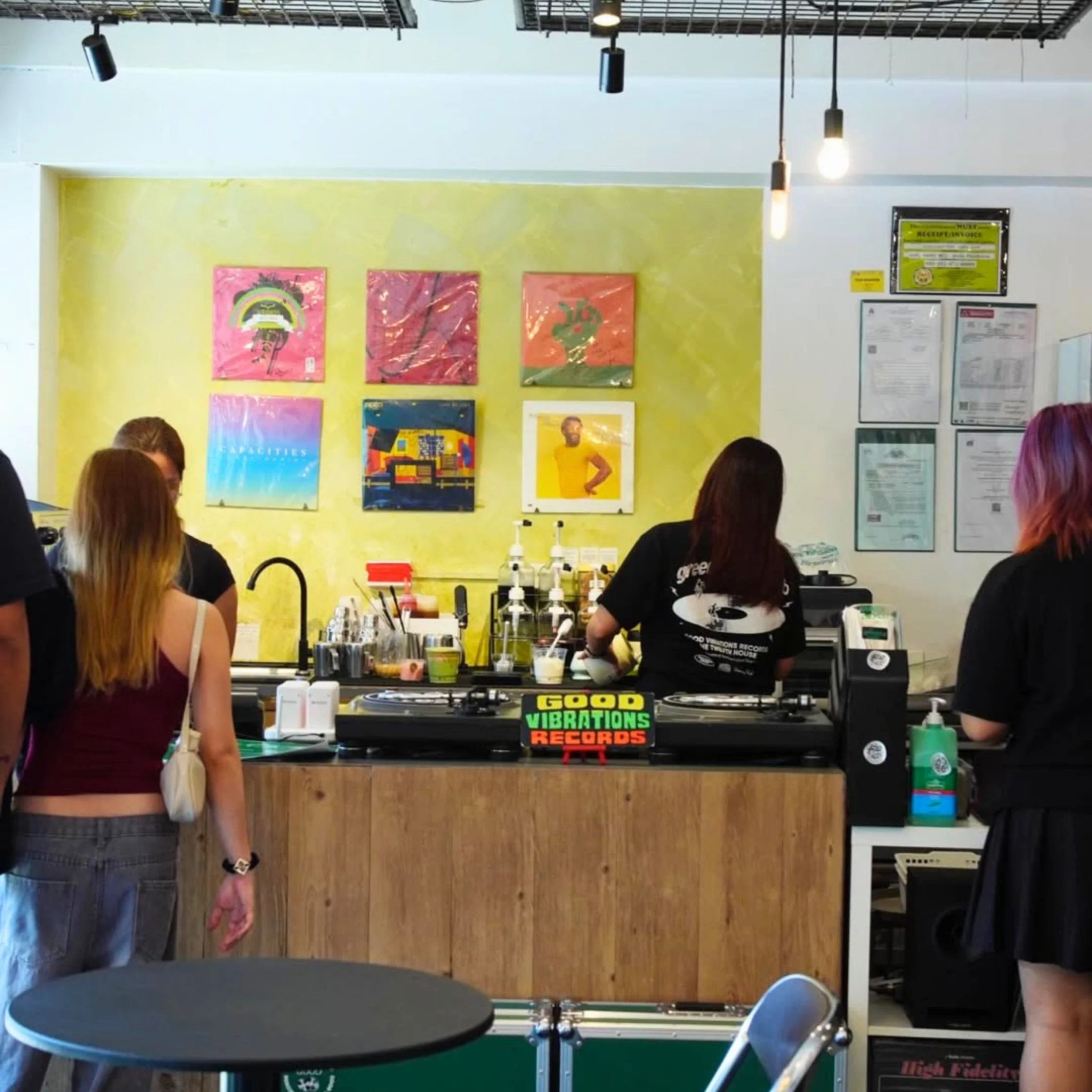 Customers inside Good Vibrations Records in Cubao Expo browsing records and enjoying coffee.