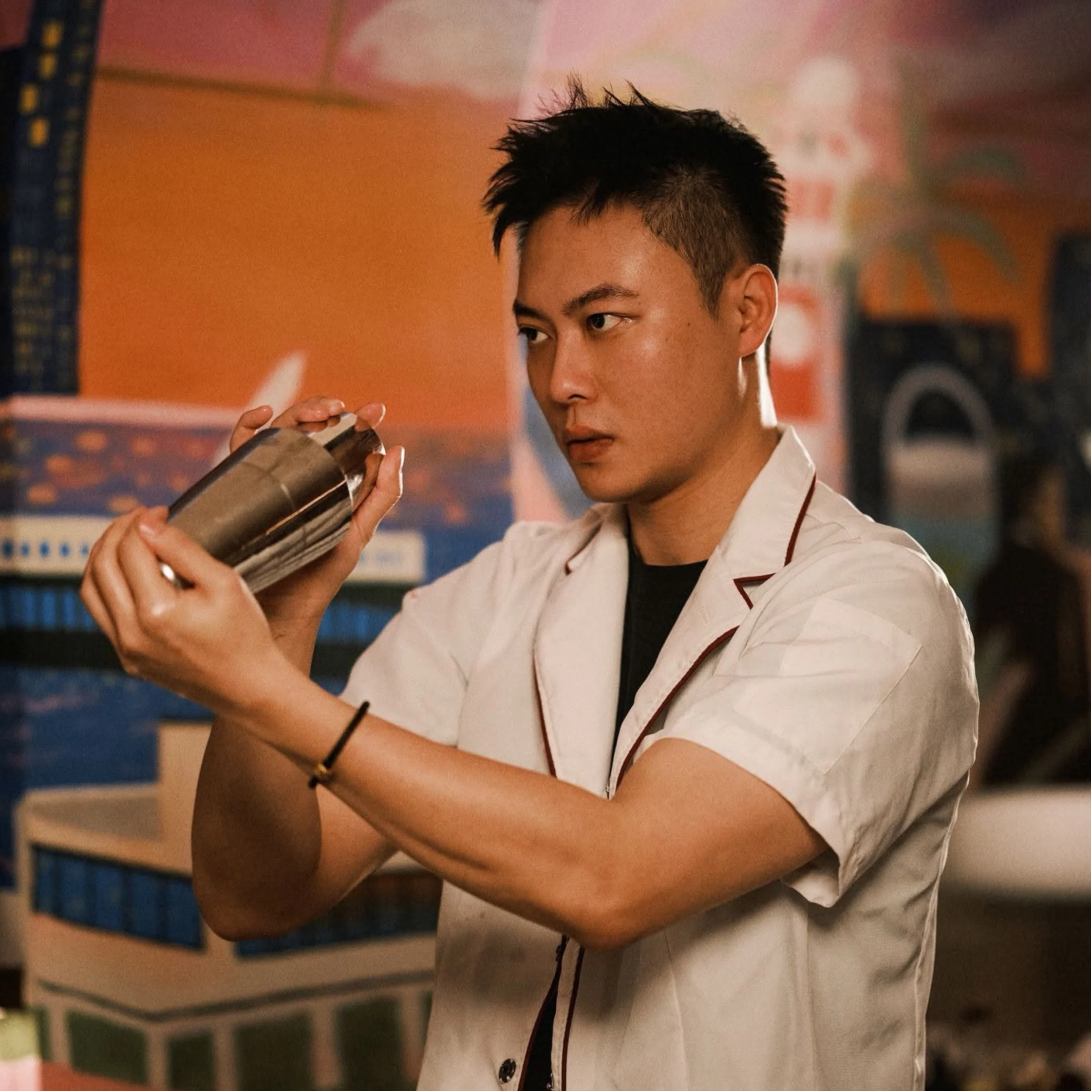 A bartender from Hong Kong cocktail salon Kinsman carefully shakes a cocktail during preparations for the Kinsman x Lazy Suzy collaboration, which explores the shared stories of SoHo and Binondo through drinks and dining.