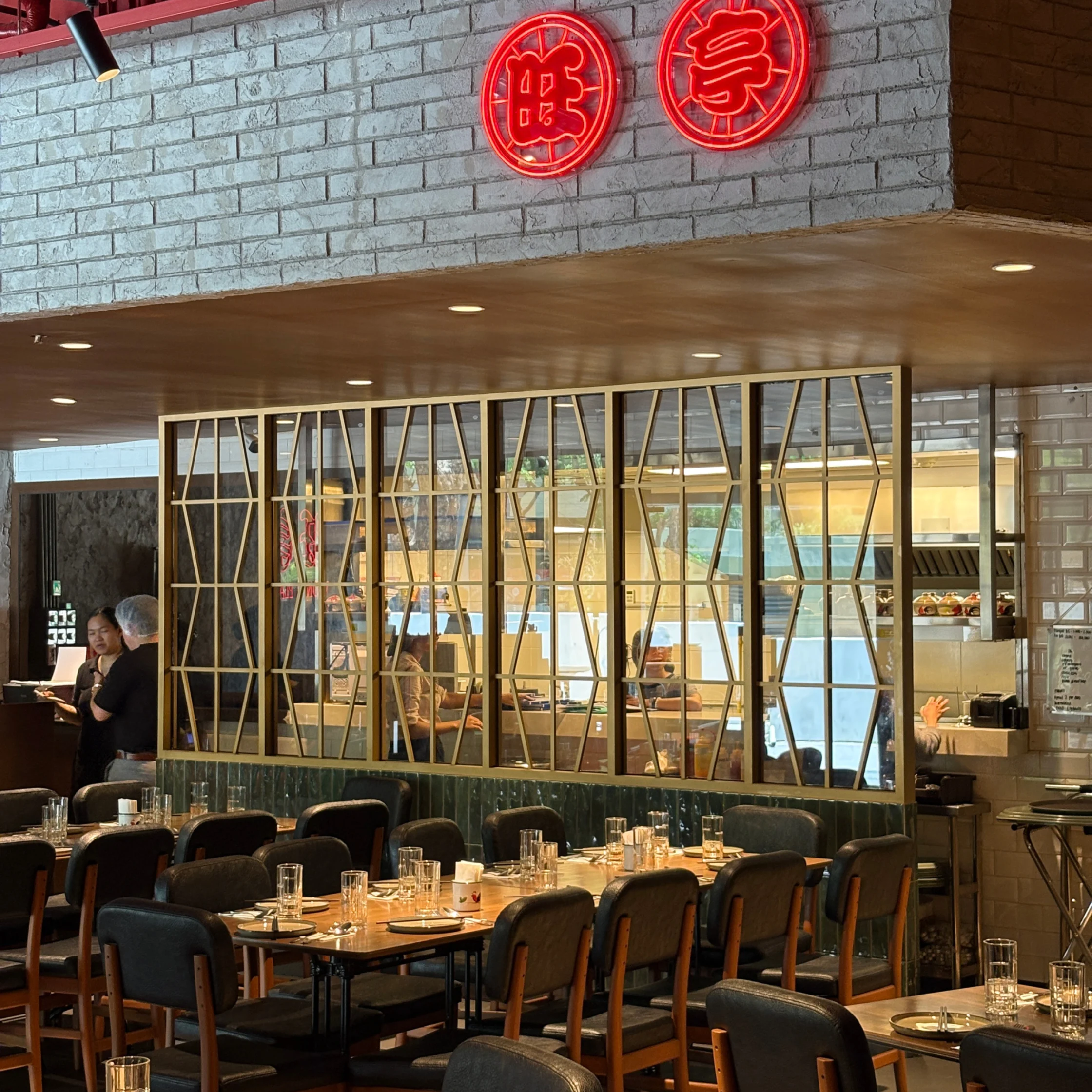 wong place capital commons pasig interior that's industrial with fun pops of color like red and green with warm lighting