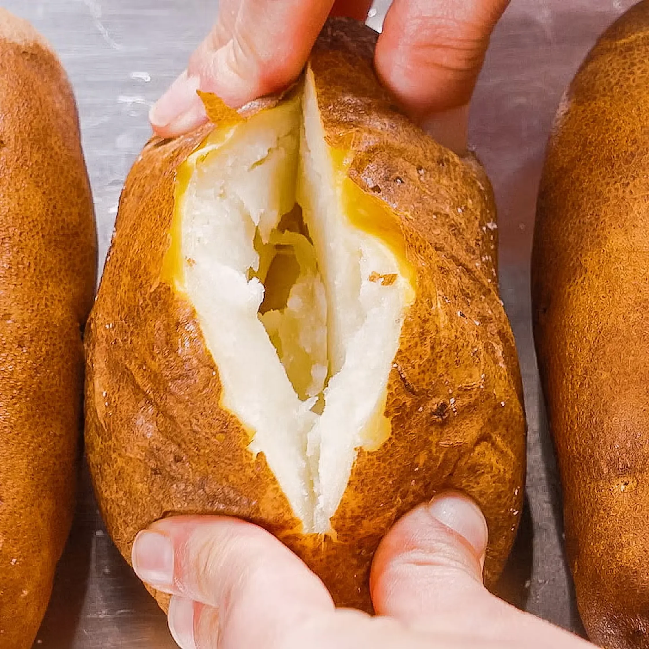 Cut a slit in the top—don't cut potato all the way to the ends