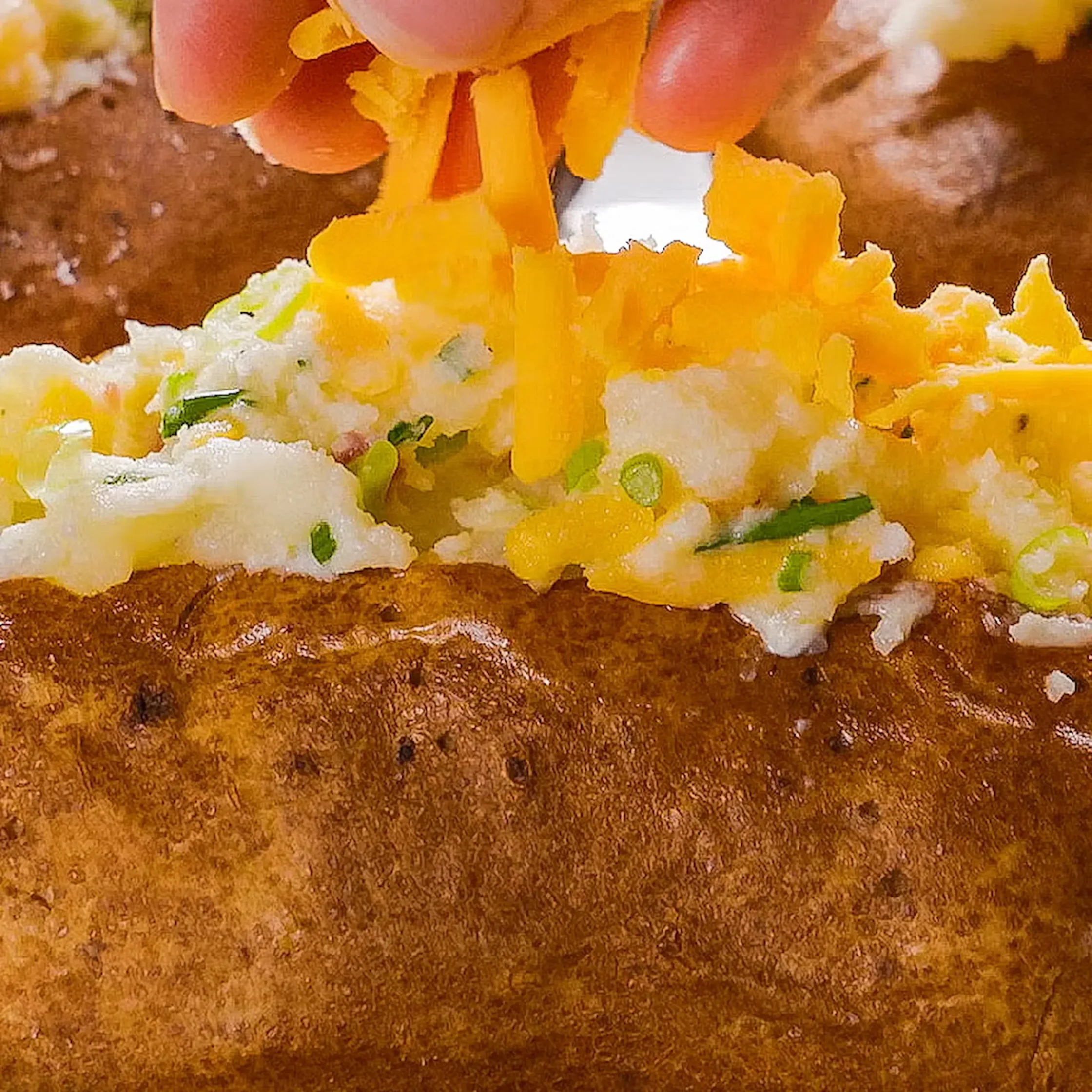 Top the potatoes with the remaining cheddar.