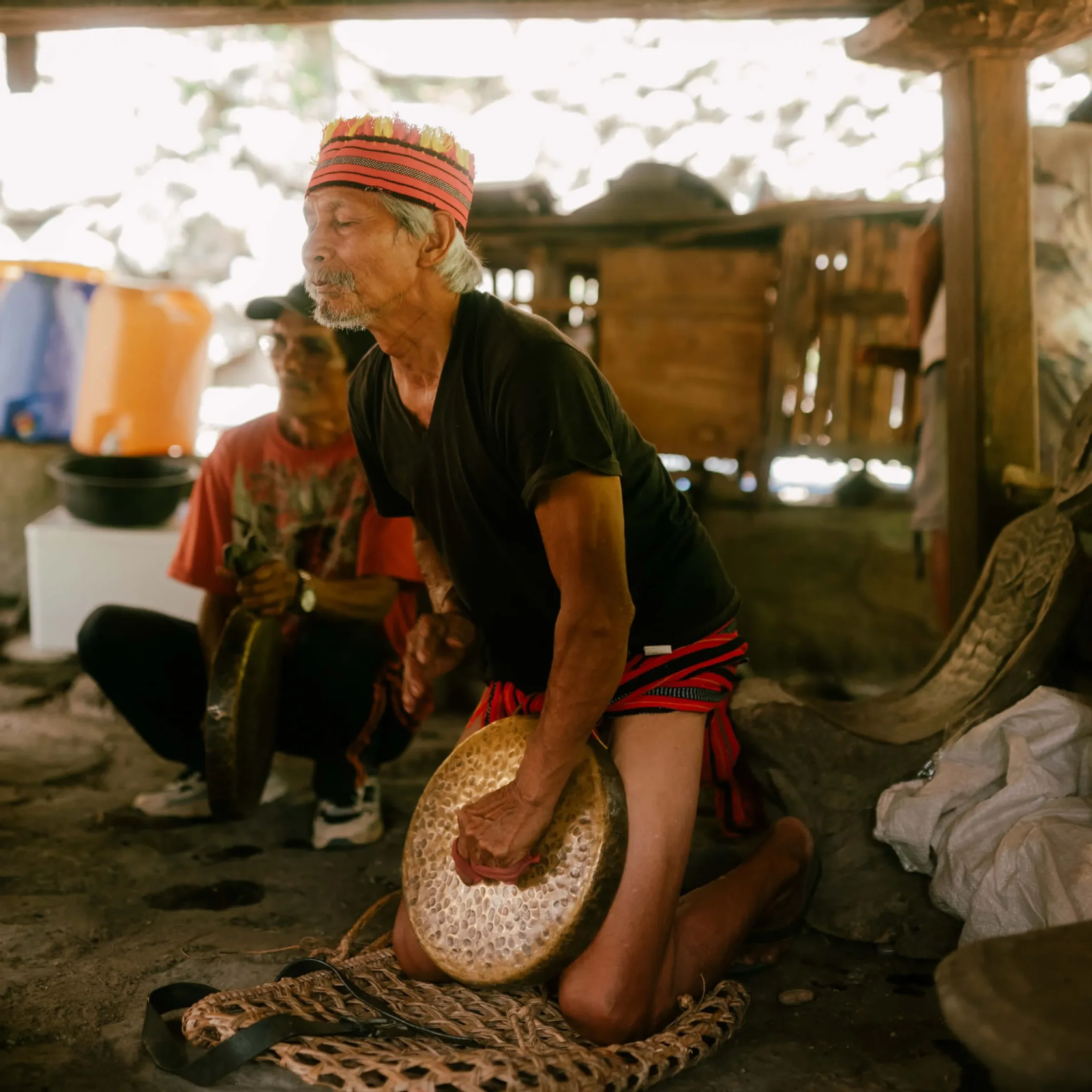 Elderly Batad Ifugaonon does the tobob main beat of the three gongs