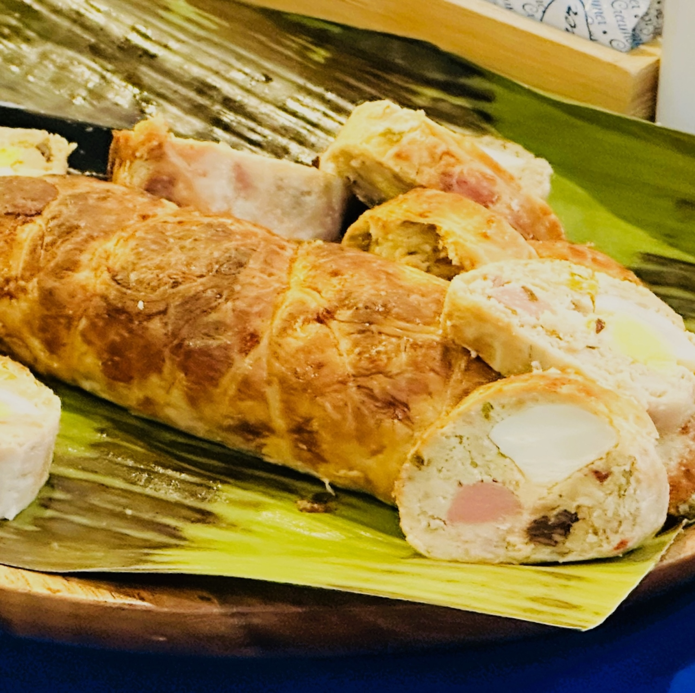 Meat log on top of banana leaves