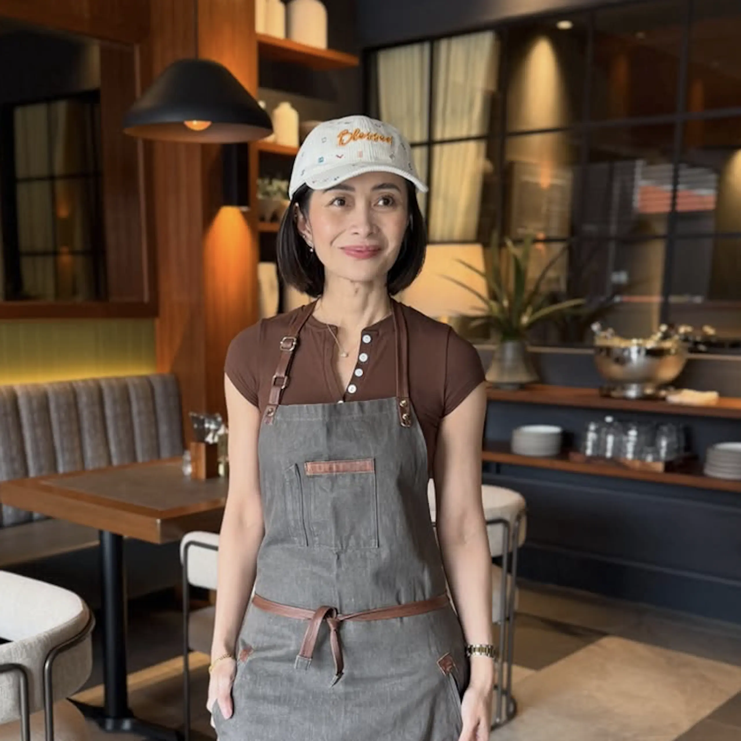 Chef Rosebud Benitez standing inside 201 Brunch and Bistro