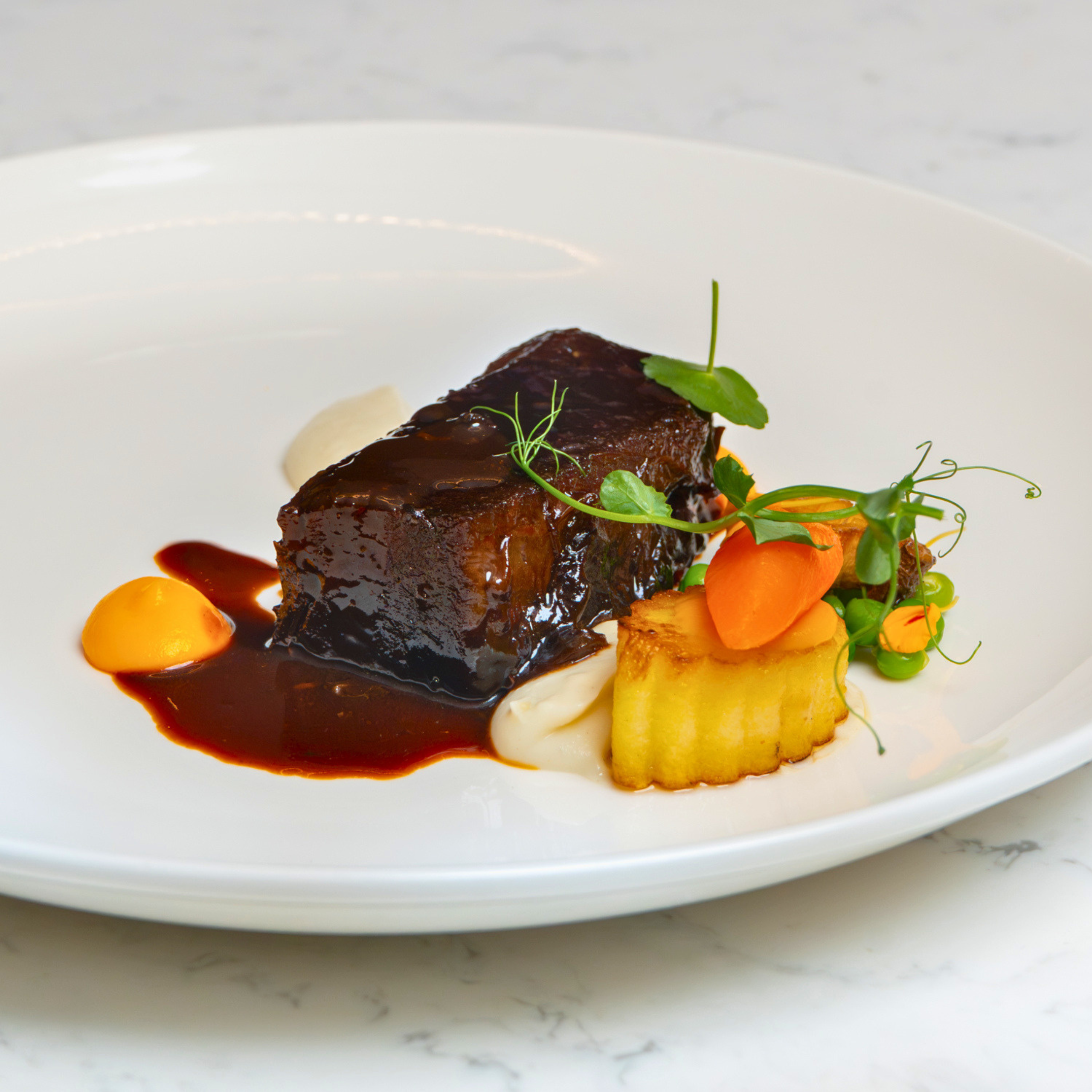 Fifth Course - Grinding Refining Leyte cacao cocoa powder-aged Wagyu smoked beef short ribs celeriac purée and cacao husk jus