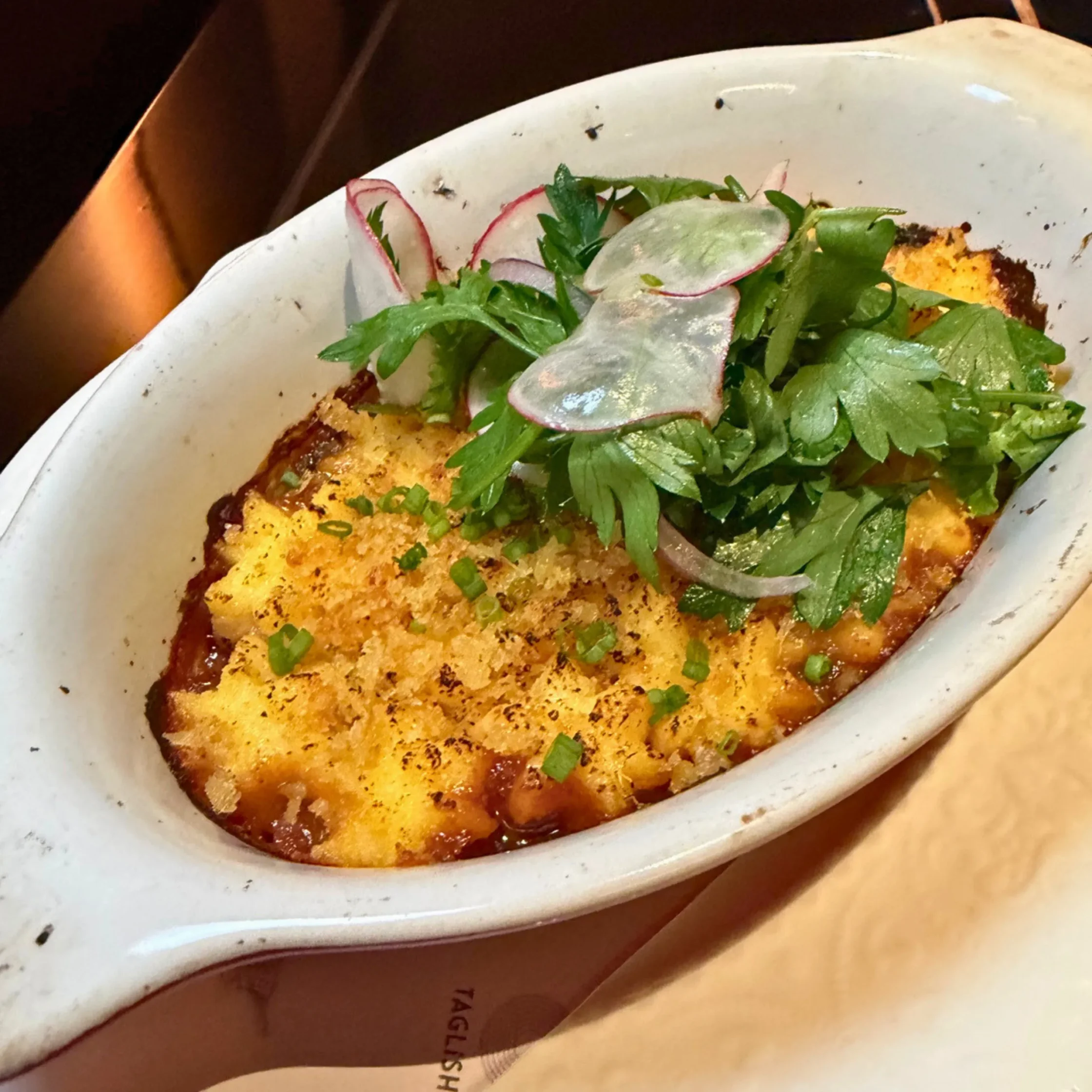 deep dish plate with potatoes inside