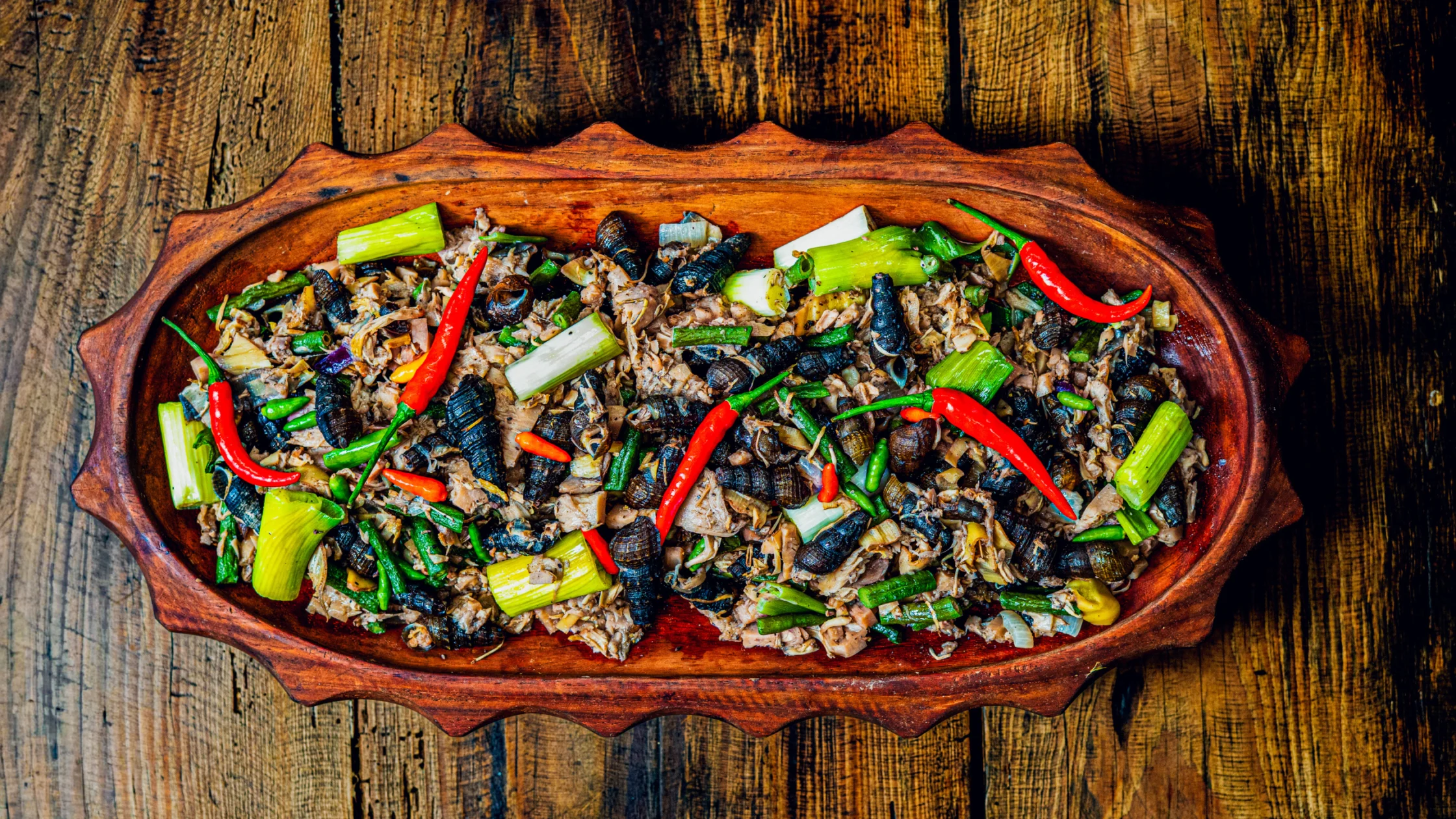 kalinga binugor made with freshwater snails, bamboo shoots, wild mushrooms, chili peppers, and whatever edible plants