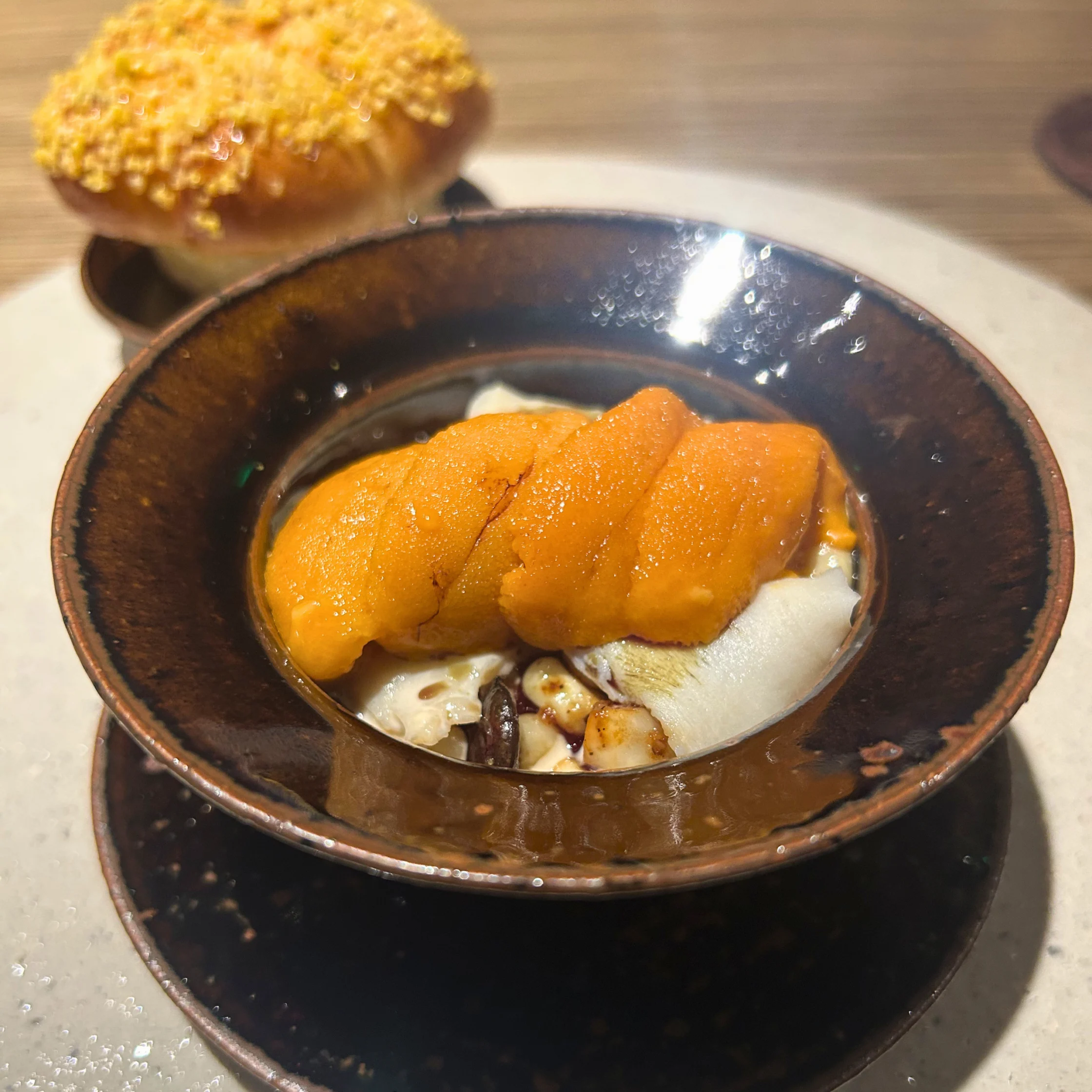 corn custard with pumpkin seeds uni and served with barbecued cornbread