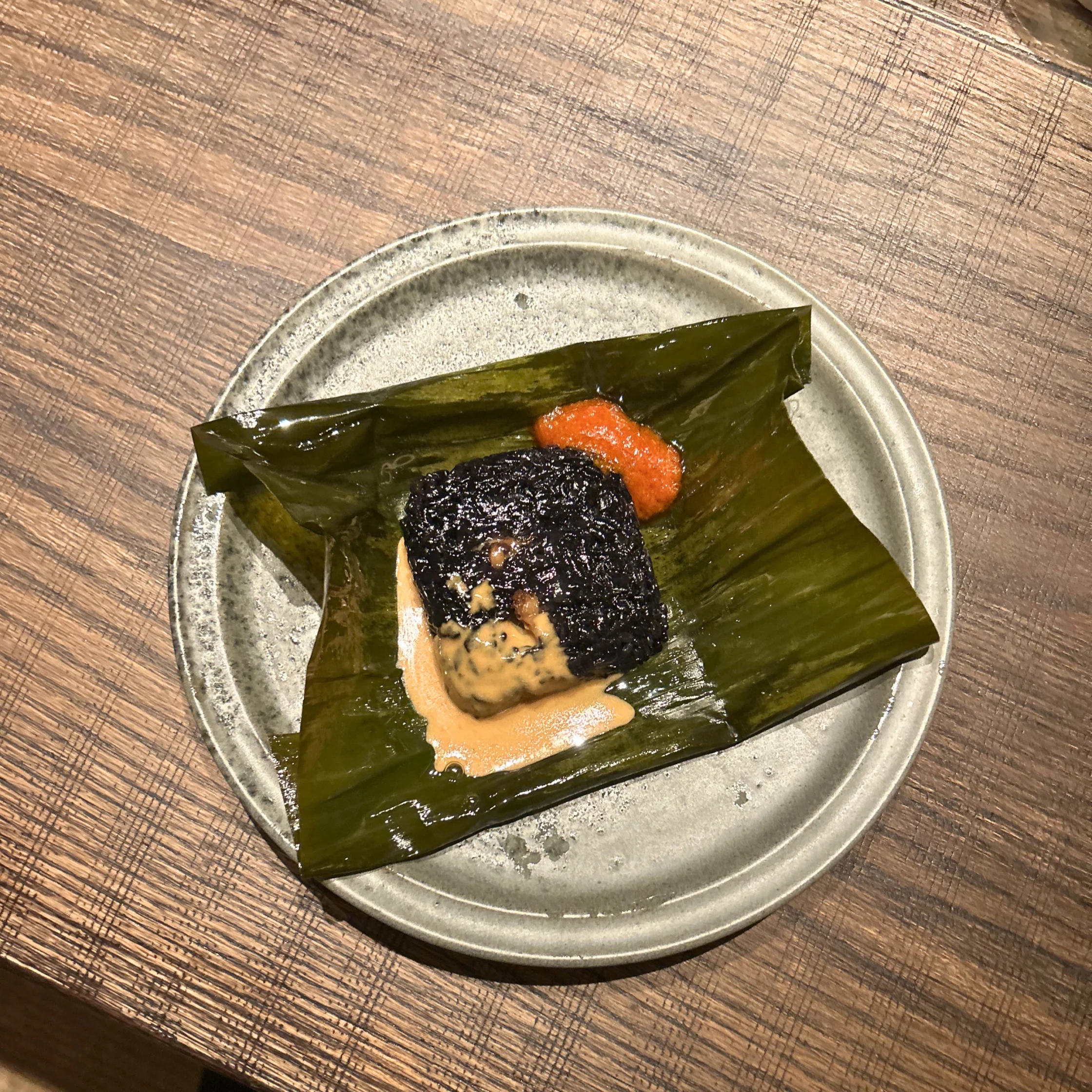 lamdre_glutinous rice wrapped in banana leaf and baked for two hours in a dough of plant ash and pine needle