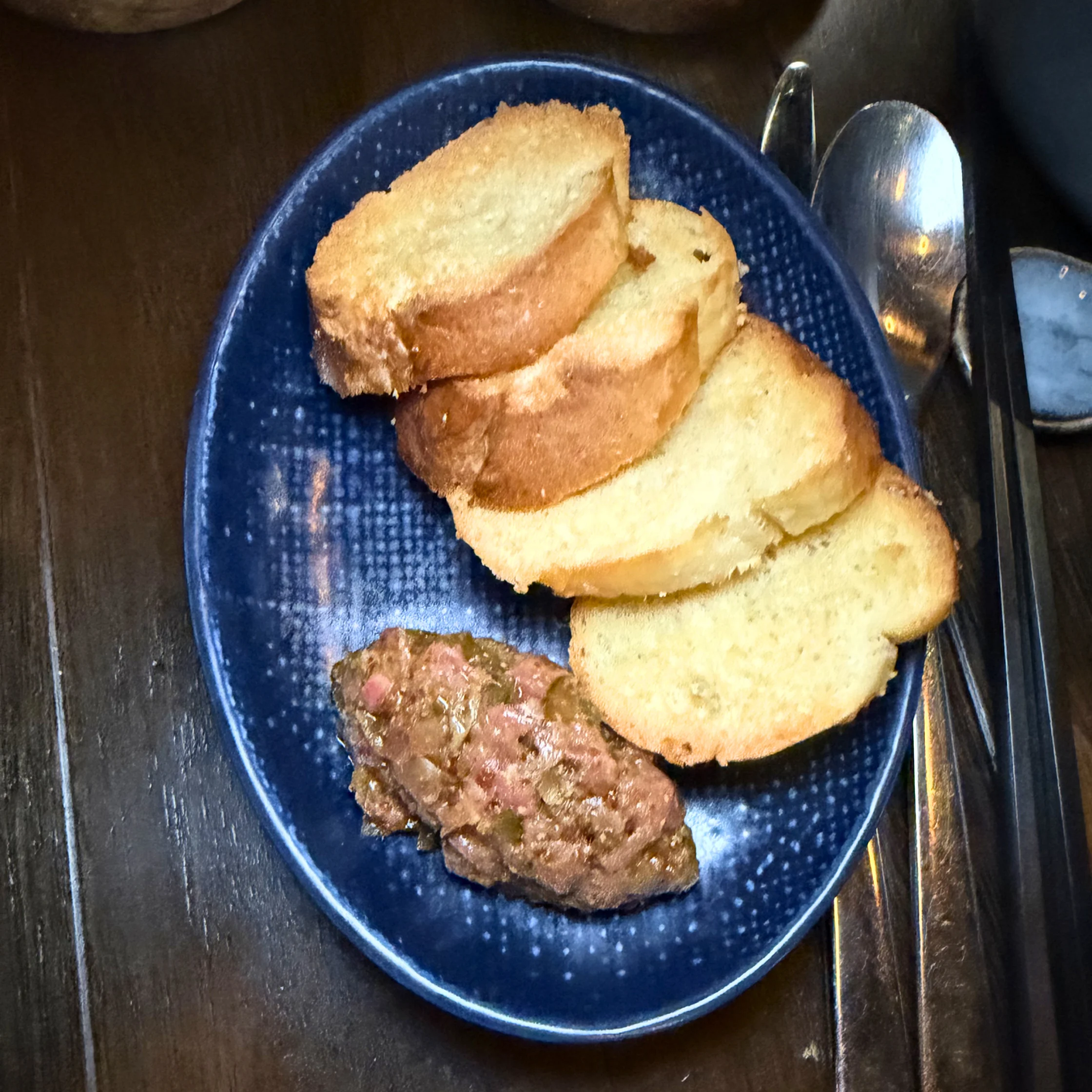 side dish of c75s chao long is this beef tartare with Vietnamese baguette