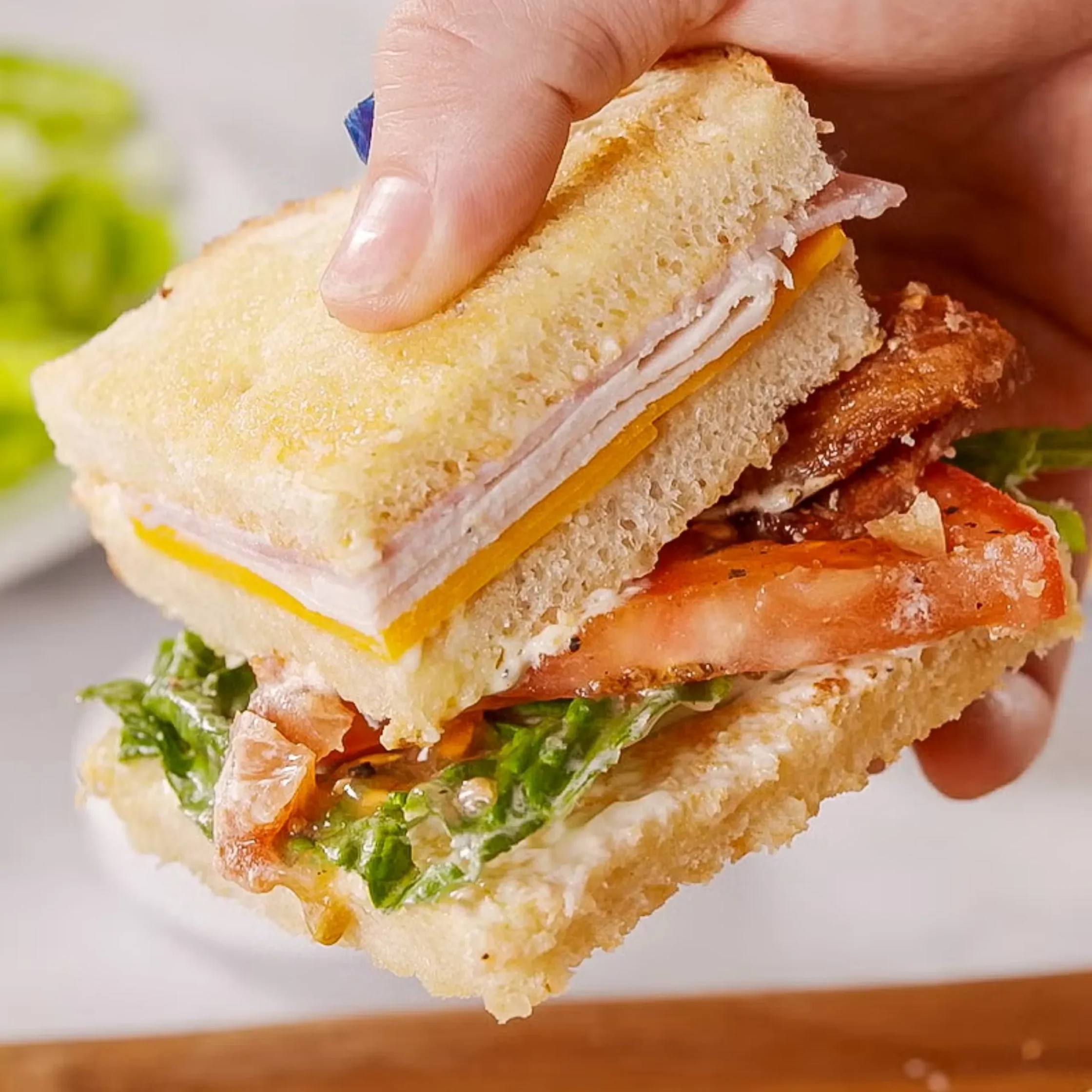 Cutting this sandwich into triangles is traditional for a reason: It makes it so much easier to enjoy.