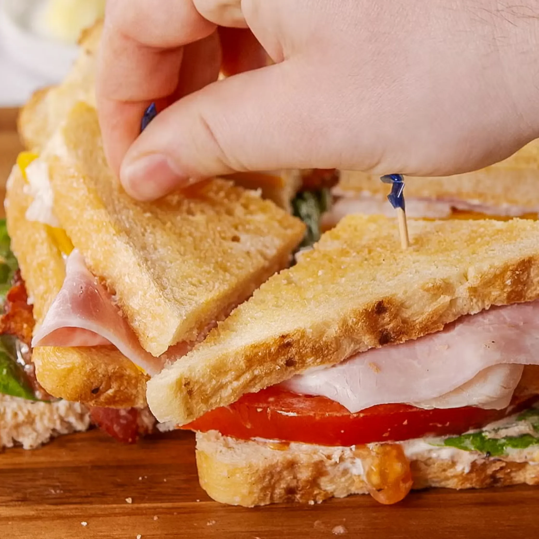 Cutting this sandwich into triangles is traditional for a reason: It makes it so much easier to enjoy.