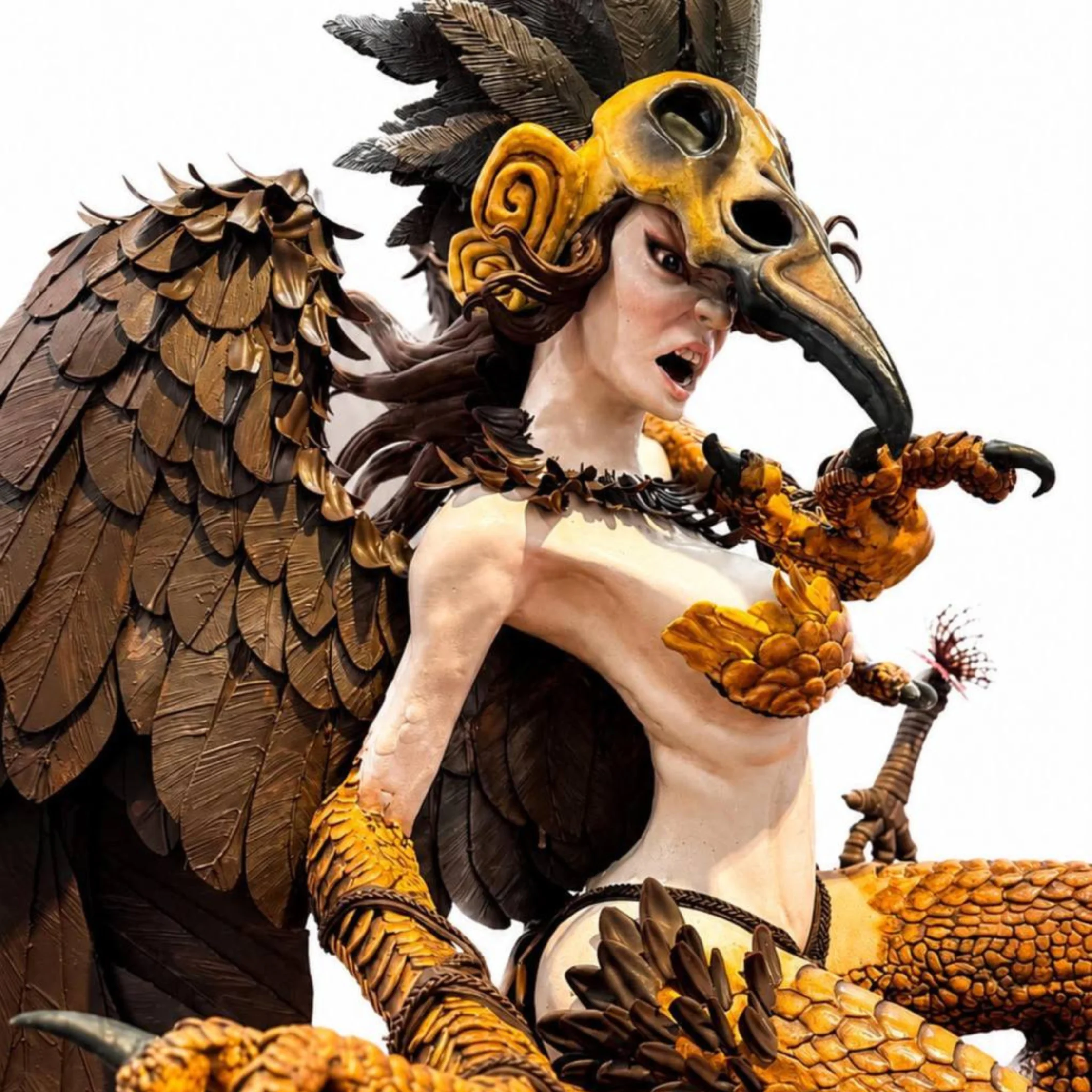 Person in an elaborate bird-costume with a yellow beak, brown feathered wings, and ornate details Best Pastry Chef of the Year Jeriel Encarnado Entry at PCC 1