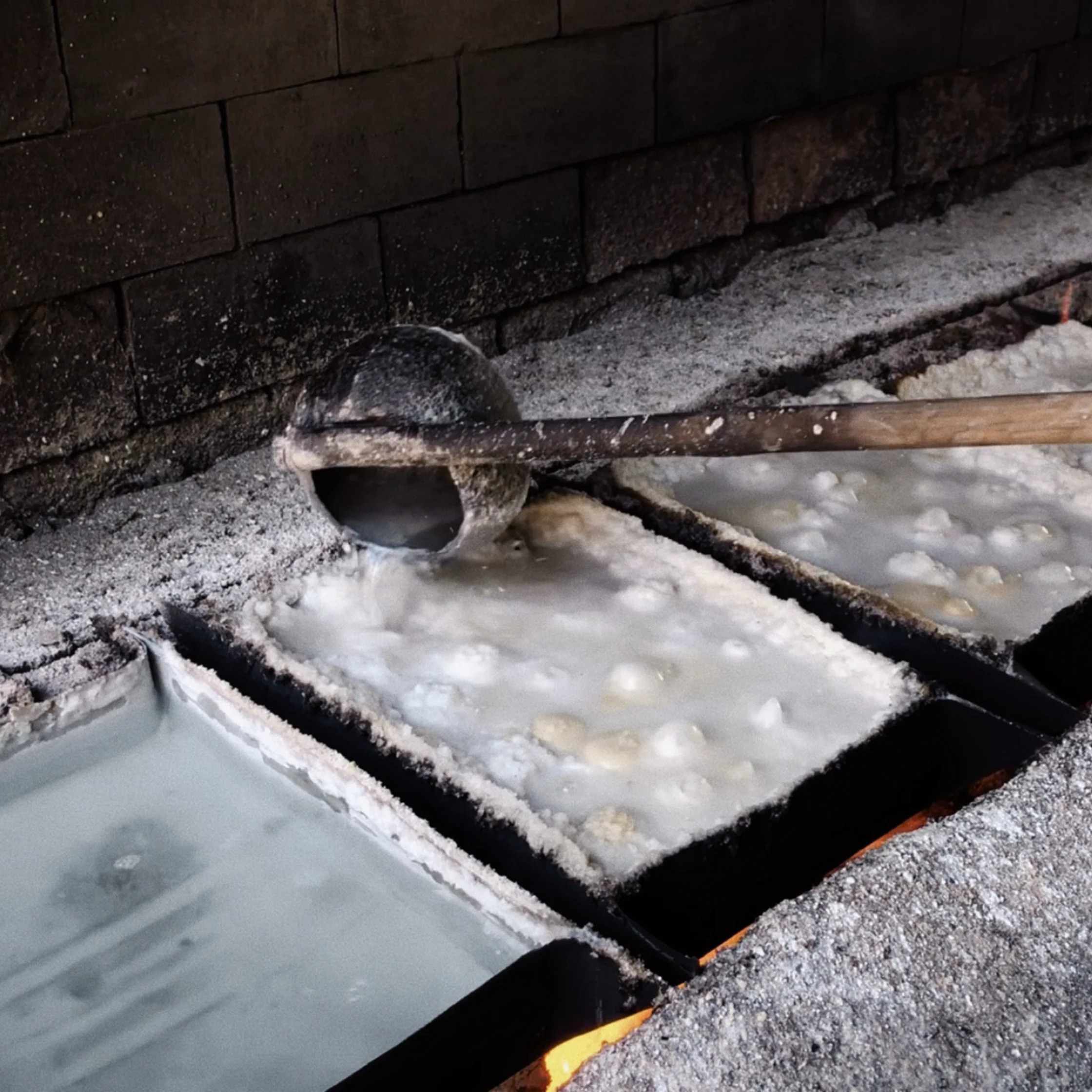 Coconut milk is added during the process and the mixture is continuously cooked until it eventually hardens into blocks of tultul
