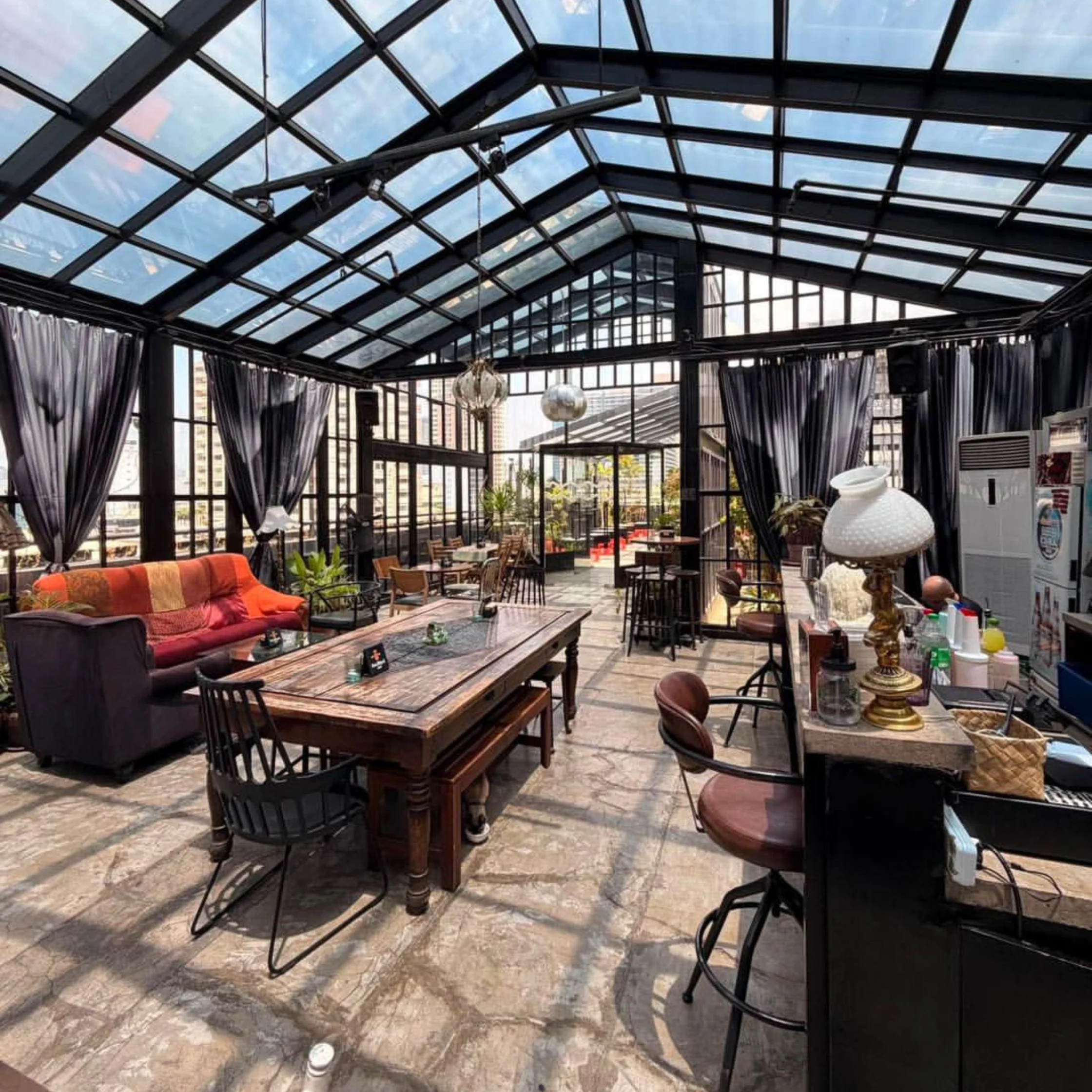 seltsam bar in legazpi village makati glasshouse with vintage furniture and pants