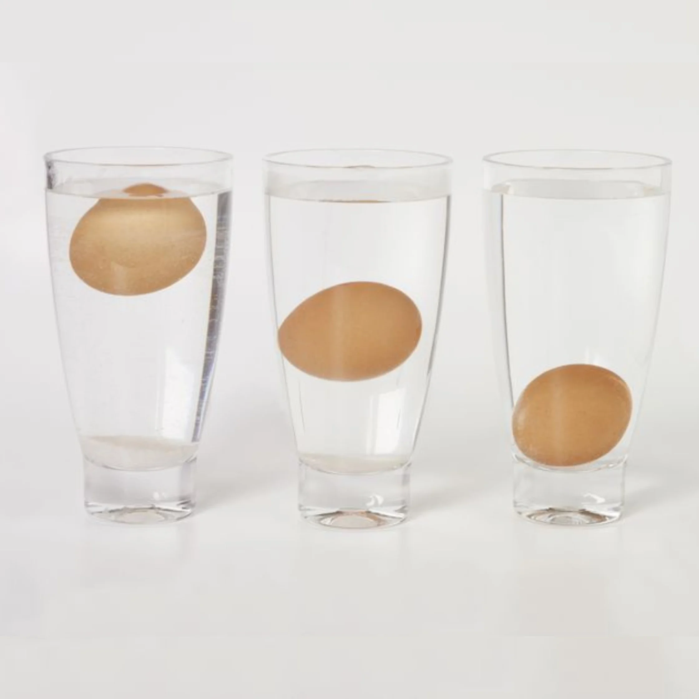floating eggs in a glass